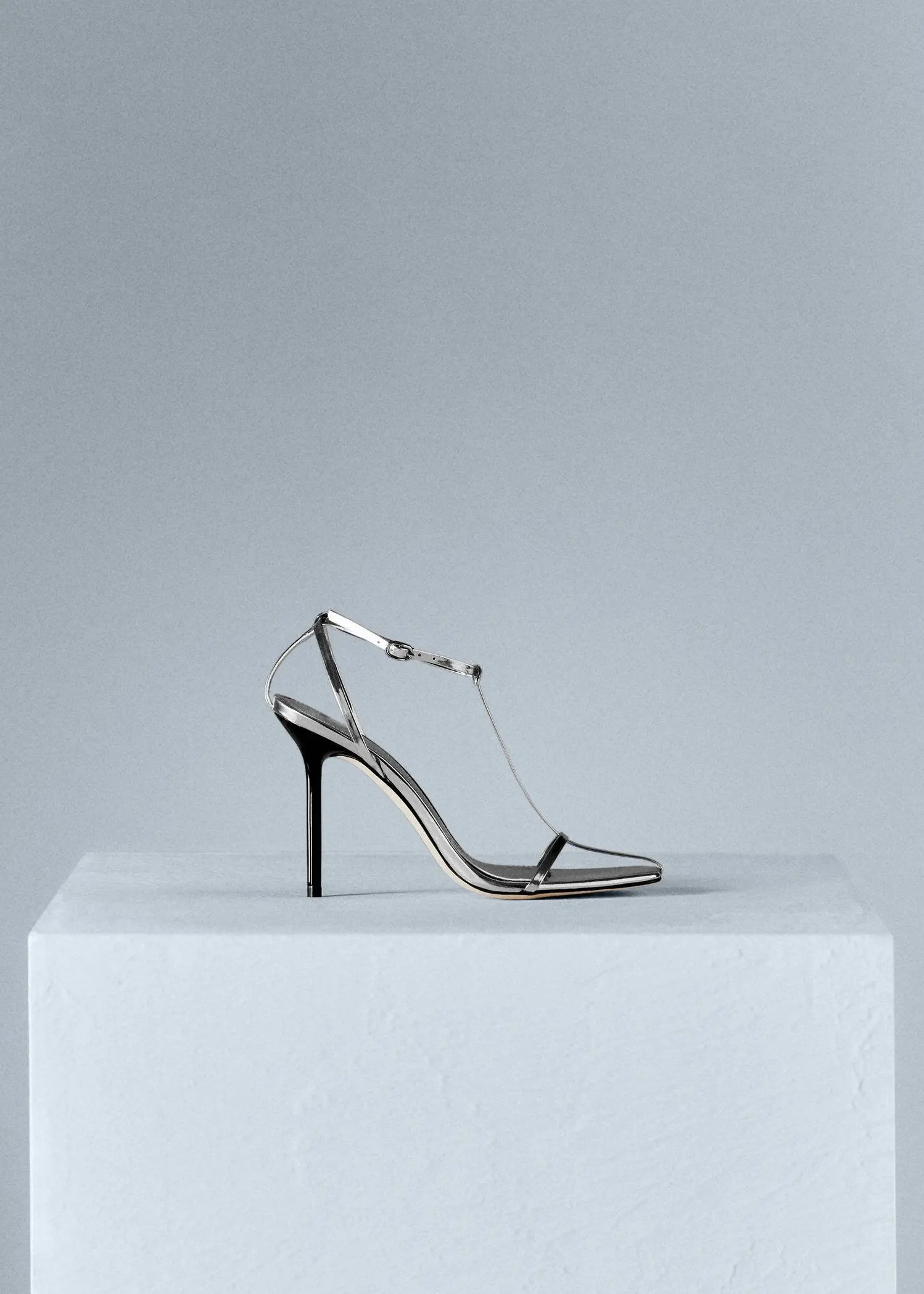 Mango Heeled leather sandals with straps. a pair of high heeled shoes sitting on top of a box. 