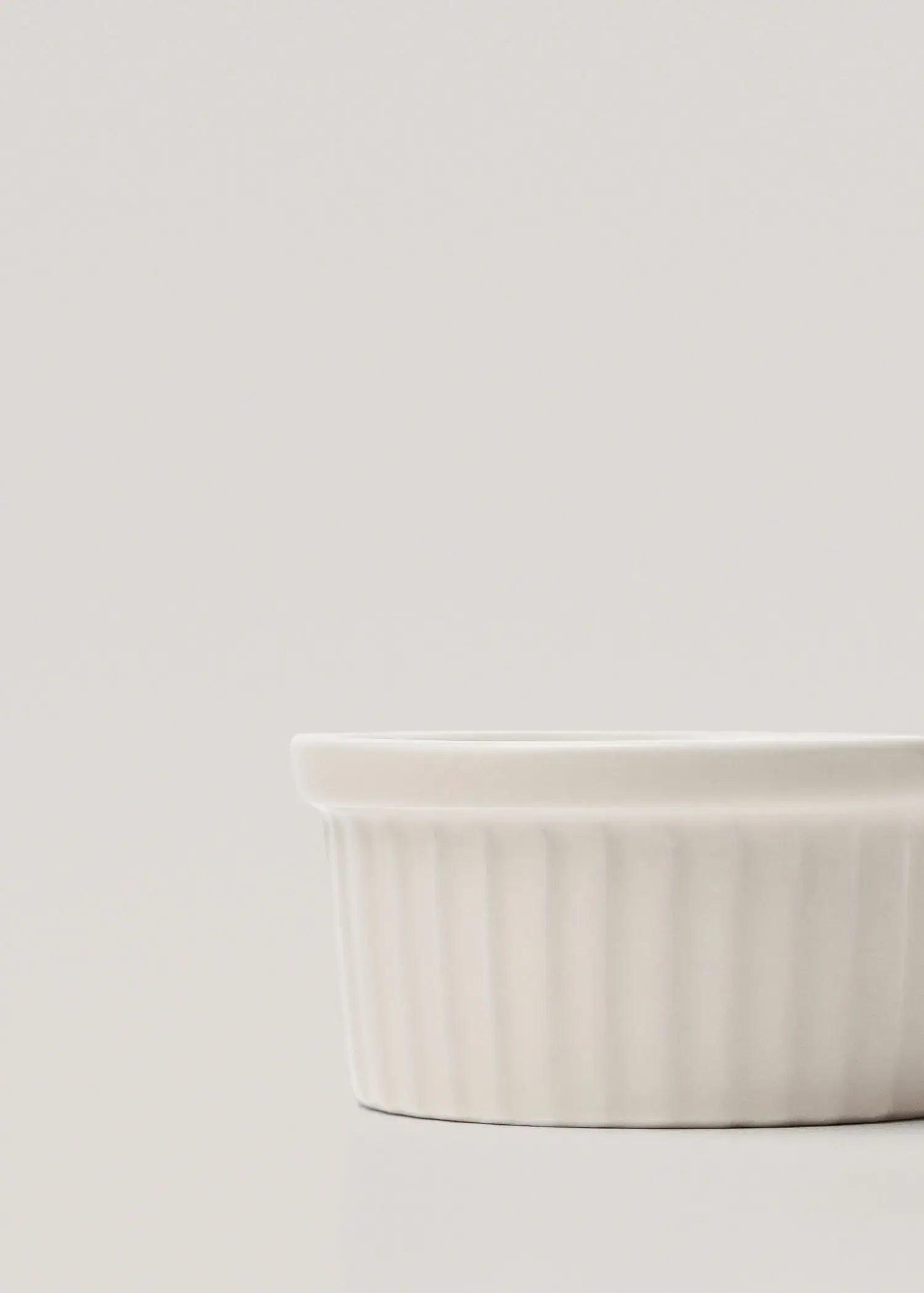 Mango Porcelain bowl 85cm. a close-up of a white bowl on a table. 