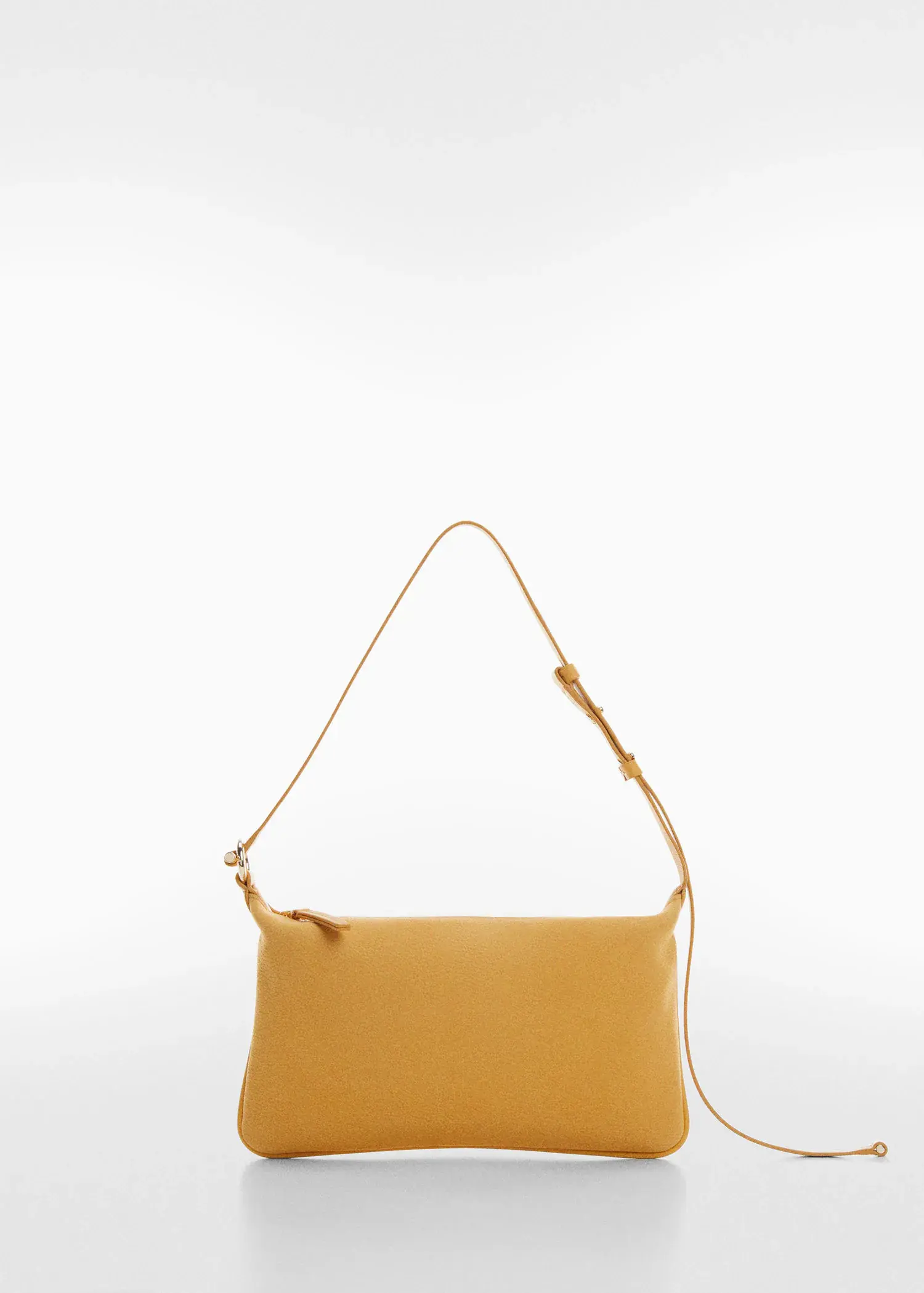 Mango Leather bag with metallic detail. a yellow purse is hanging on a white wall. 