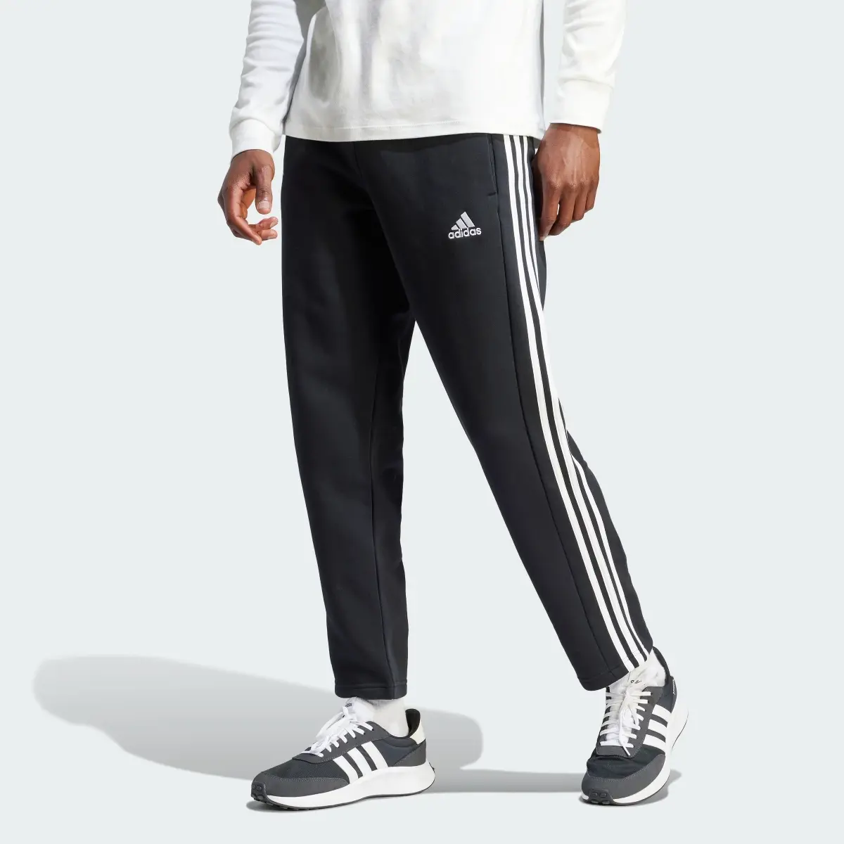 Adidas Essentials 3-Stripes Open Hem Fleece Pants. 1