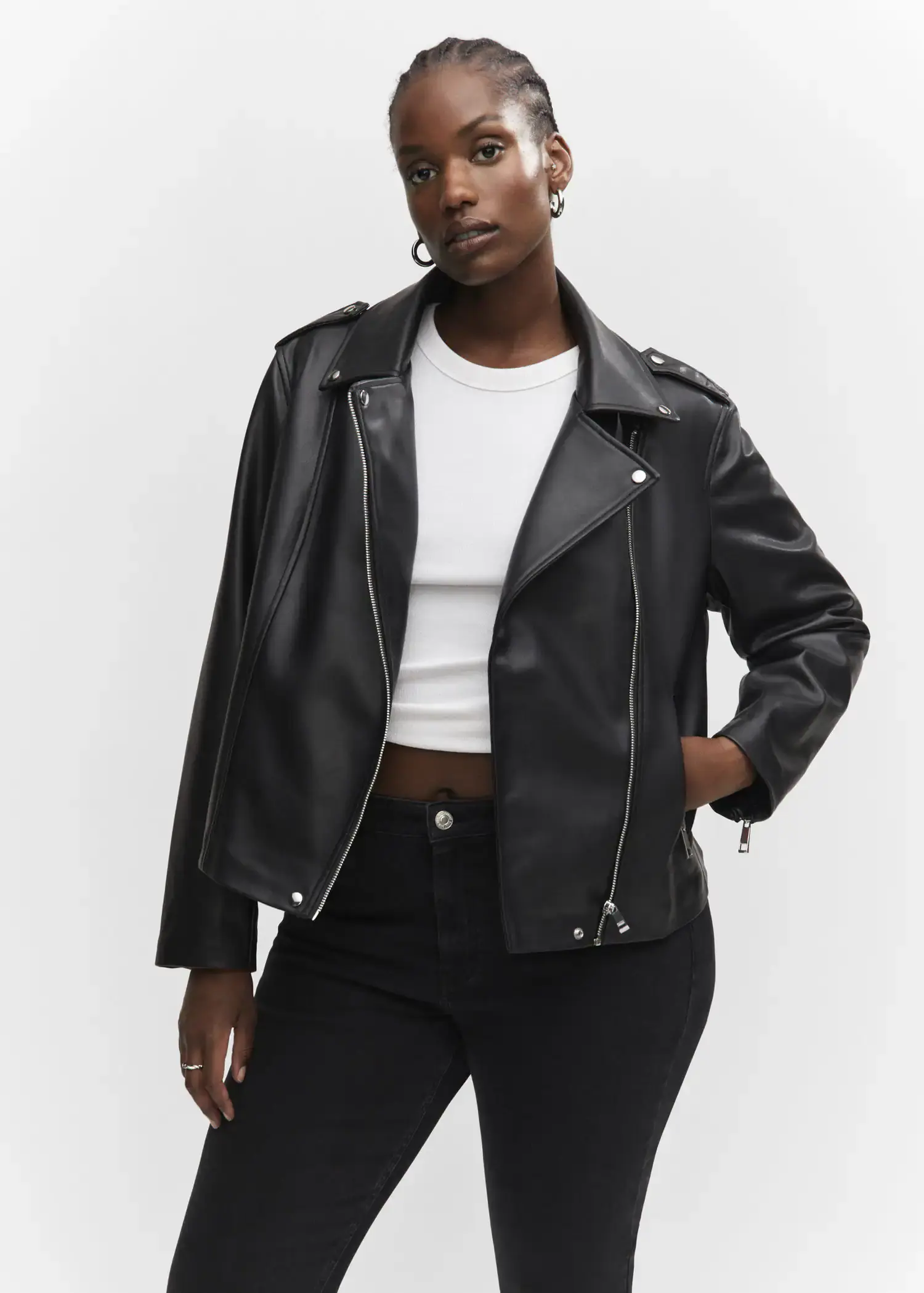 Mango Faux-leather biker jacket. a woman wearing a black leather jacket and black jeans. 