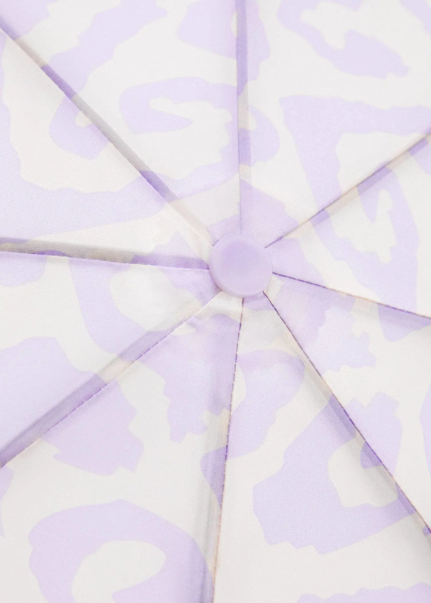 Mango Print folding umbrella. a close-up view of a purple umbrella. 