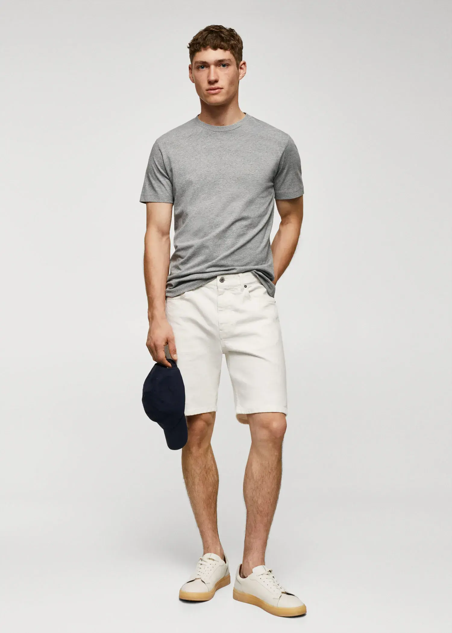 Mango Basic cotton stretch T-shirt. a young man wearing white shorts and a gray t-shirt. 