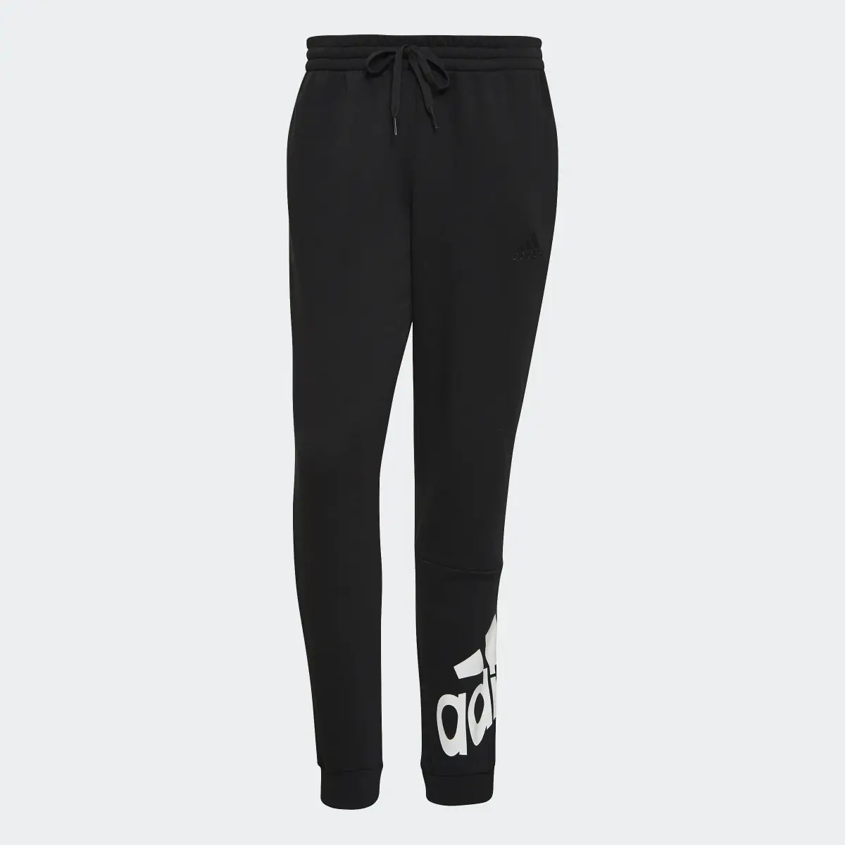 Adidas Essentials Fleece Tapered Cuff Logo Pants. 1