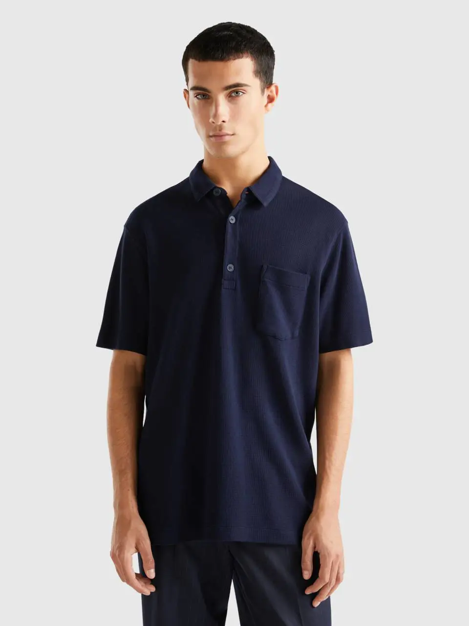Benetton polo with pocket and relaxed fit. 1