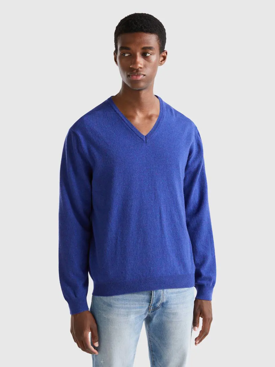 Benetton blue v-neck sweater in pure merino wool. 1