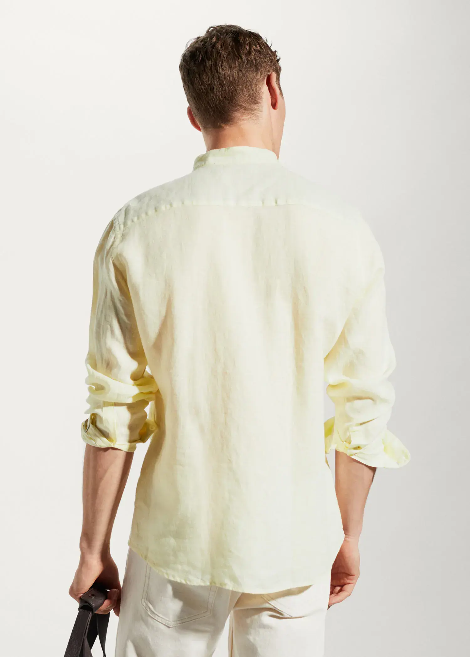 Mango 100% linen Mao collar shirt. a man in a white shirt is standing in front of a white wall. 
