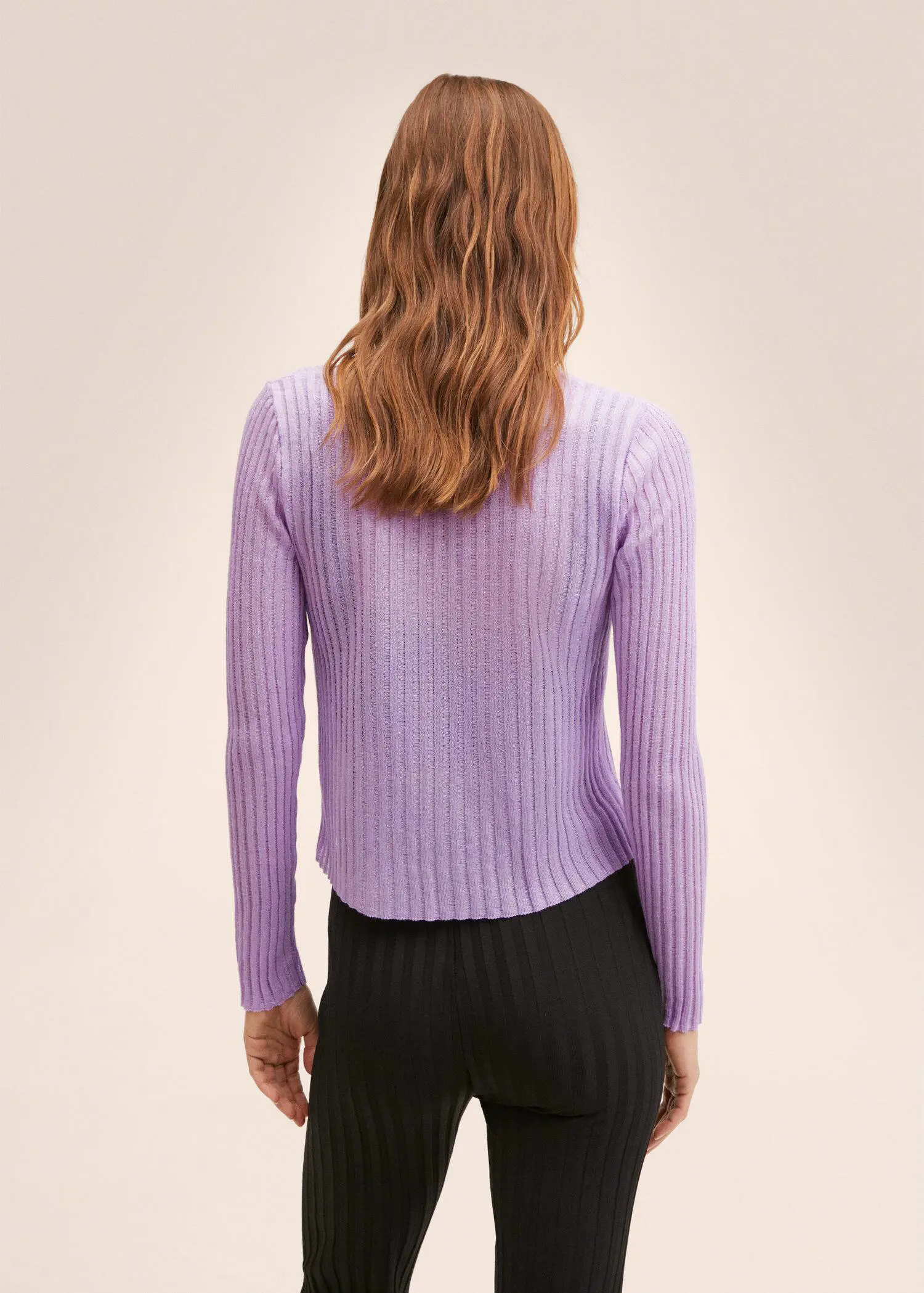 Mango Knitted cropped cardigan. a woman wearing a purple sweater standing in front of a wall. 