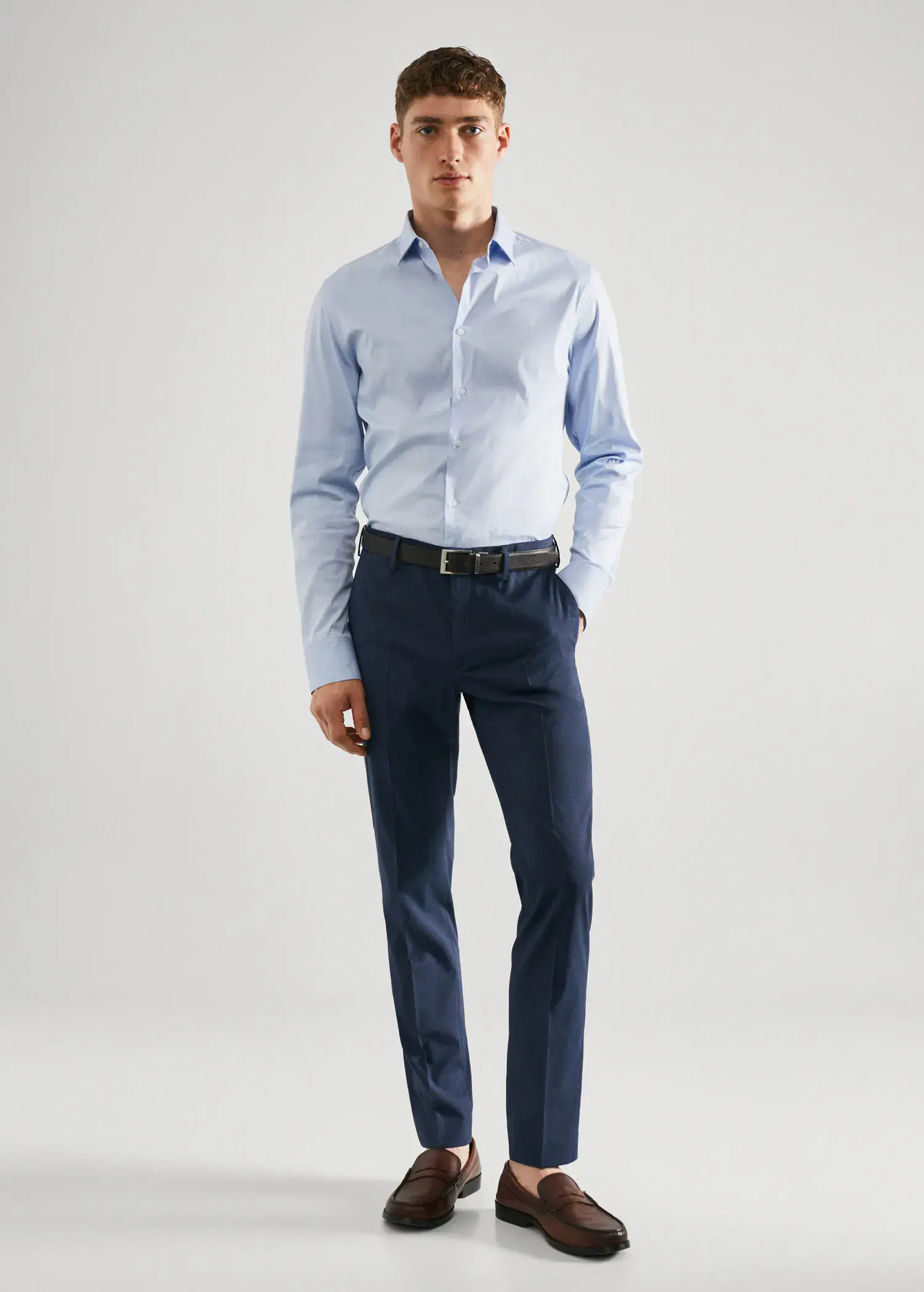 Mango Super slim fit printed suit pants. a man in a blue shirt and blue pants. 