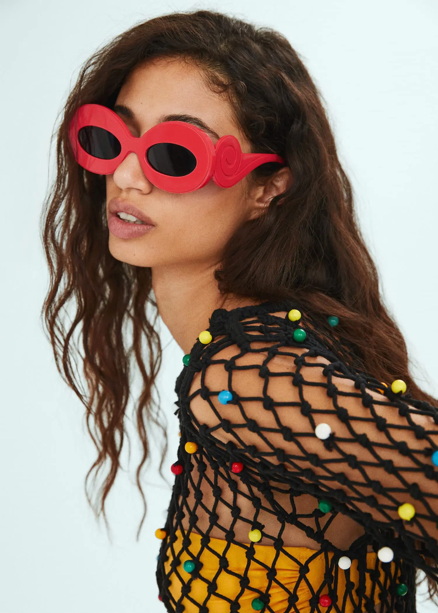Mango Maxi-frame sunglasses. a woman wearing red sunglasses and fishnets. 