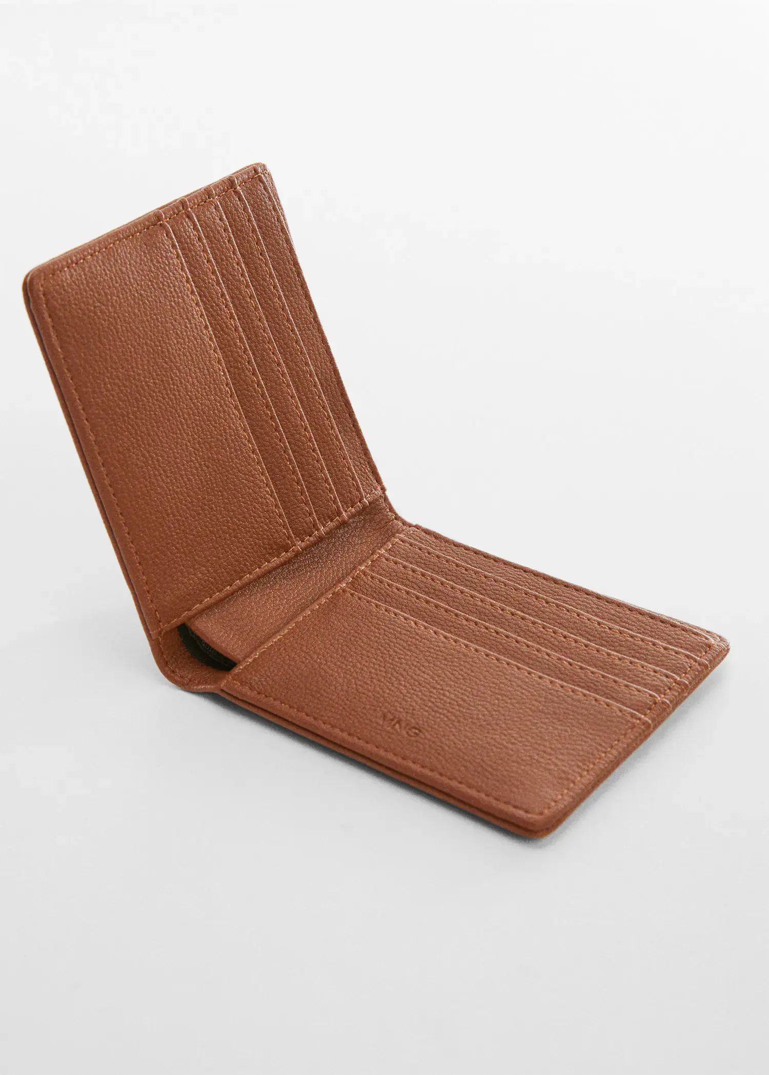 Mango Anti-contactless wallet. a brown wallet sitting on top of a white table. 