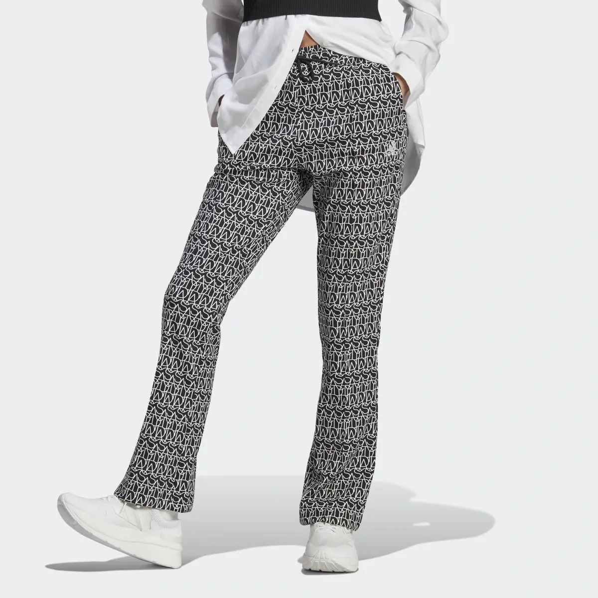 Adidas Allover adidas Graphic High-Rise Flare Pants. 1