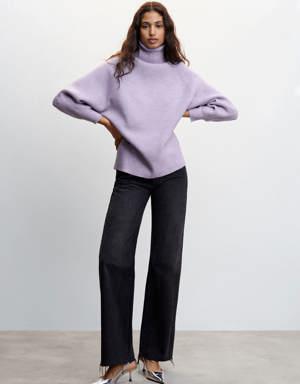Rolled neck cable sweater