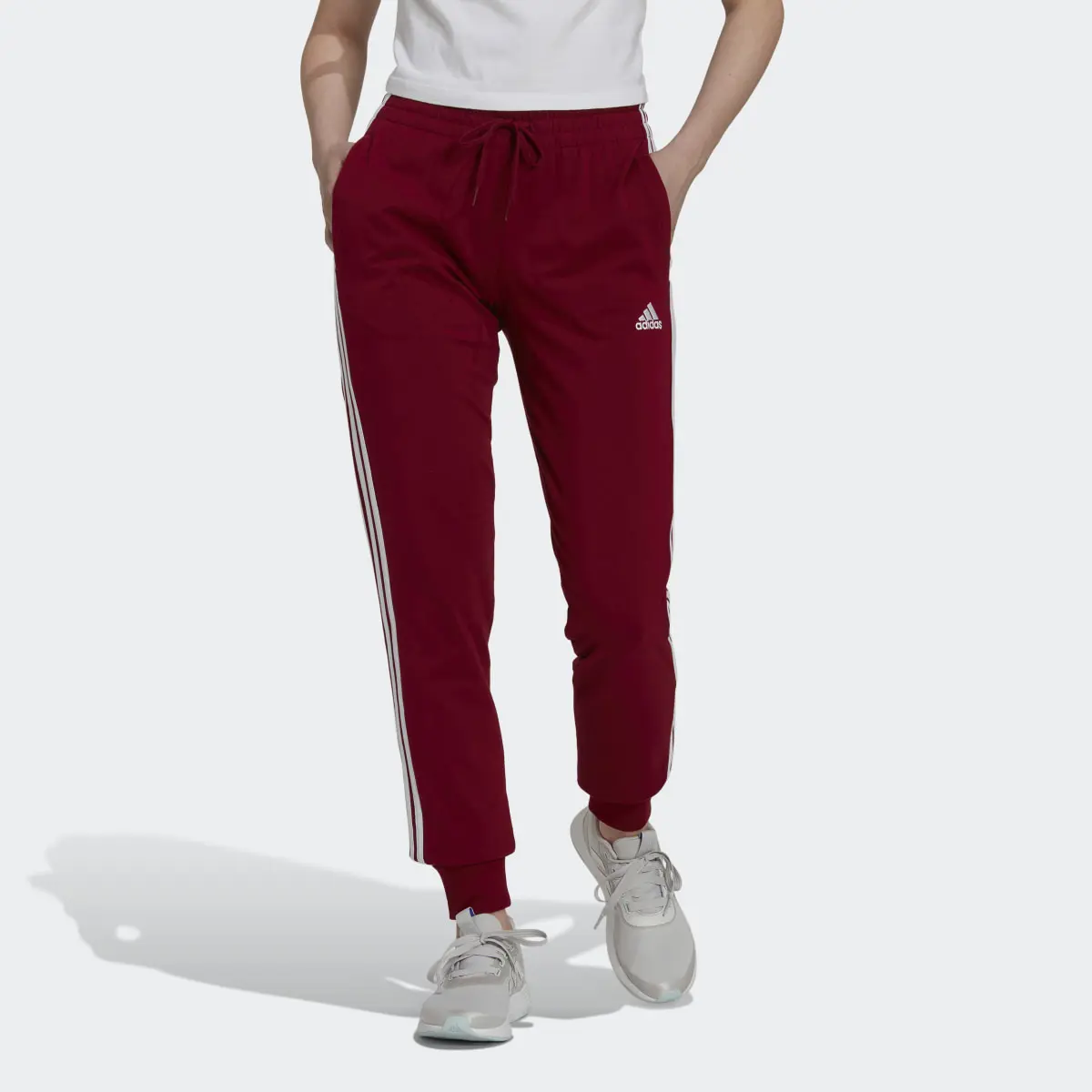 Adidas Pants Essentials 3 Franjas Tejido Jersey. 1