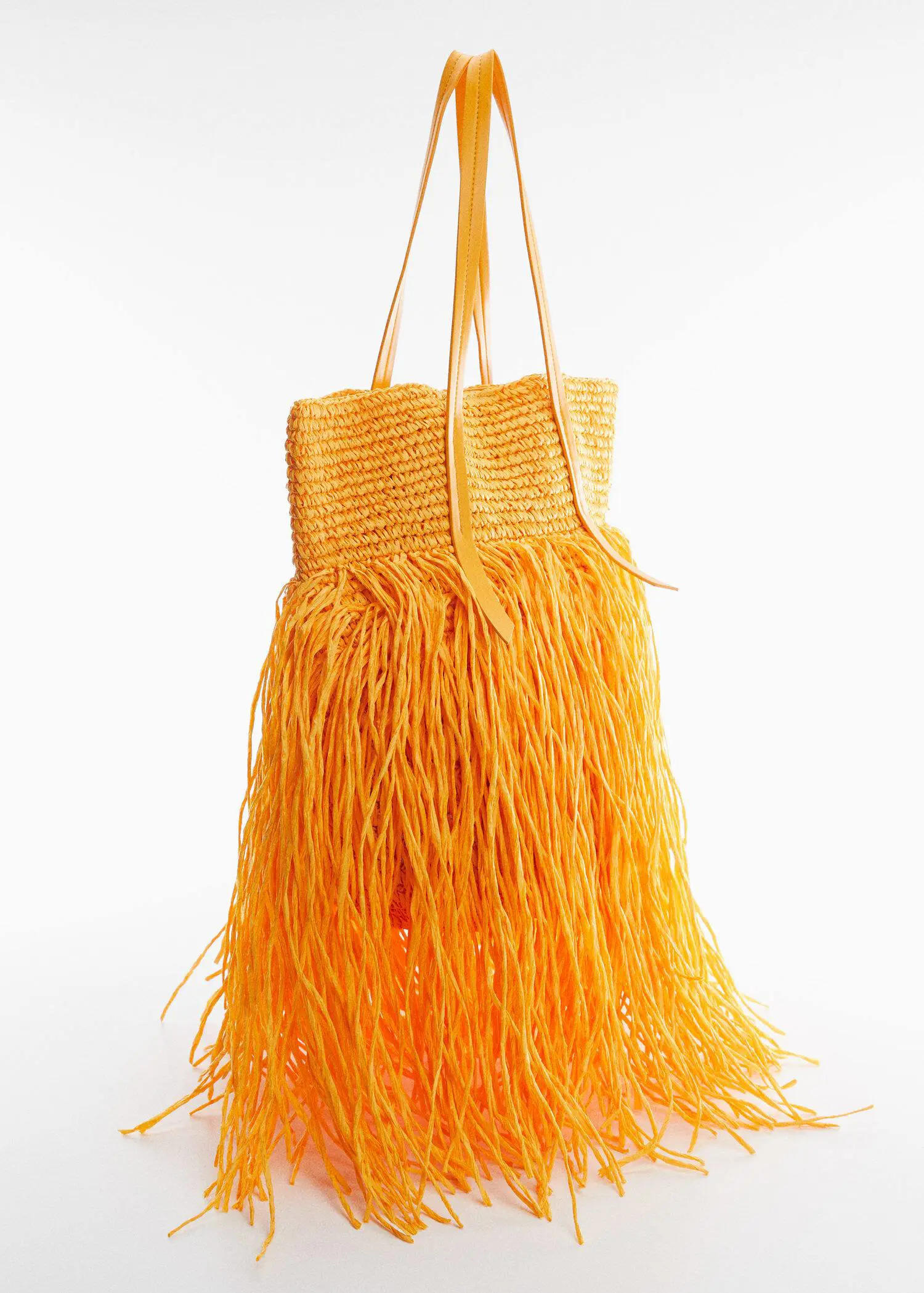 Mango  Maxi fringed natural fiber bag. a yellow bag is hanging on a string. 
