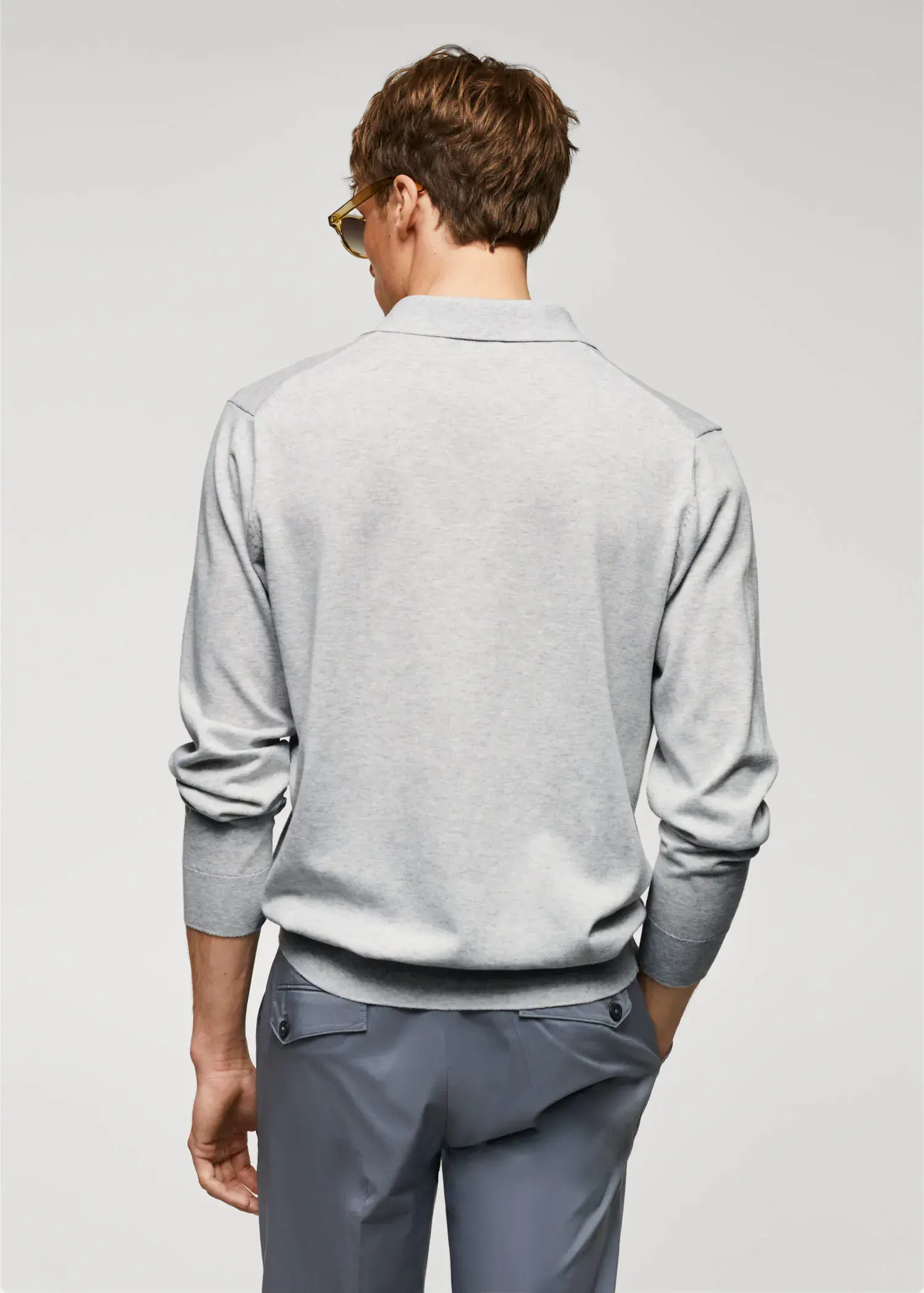 Mango Long-sleeved cotton jersey polo shirt. a man wearing a light gray sweater and sunglasses. 