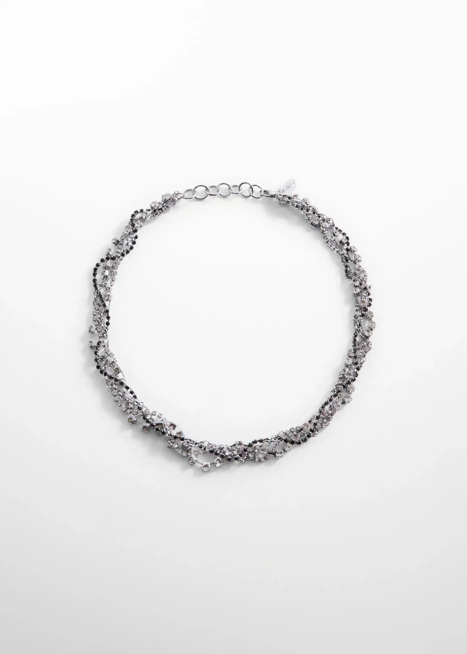 Mango Rhinestone intertwined necklace. a silver necklace is shown on top of a white surface. 