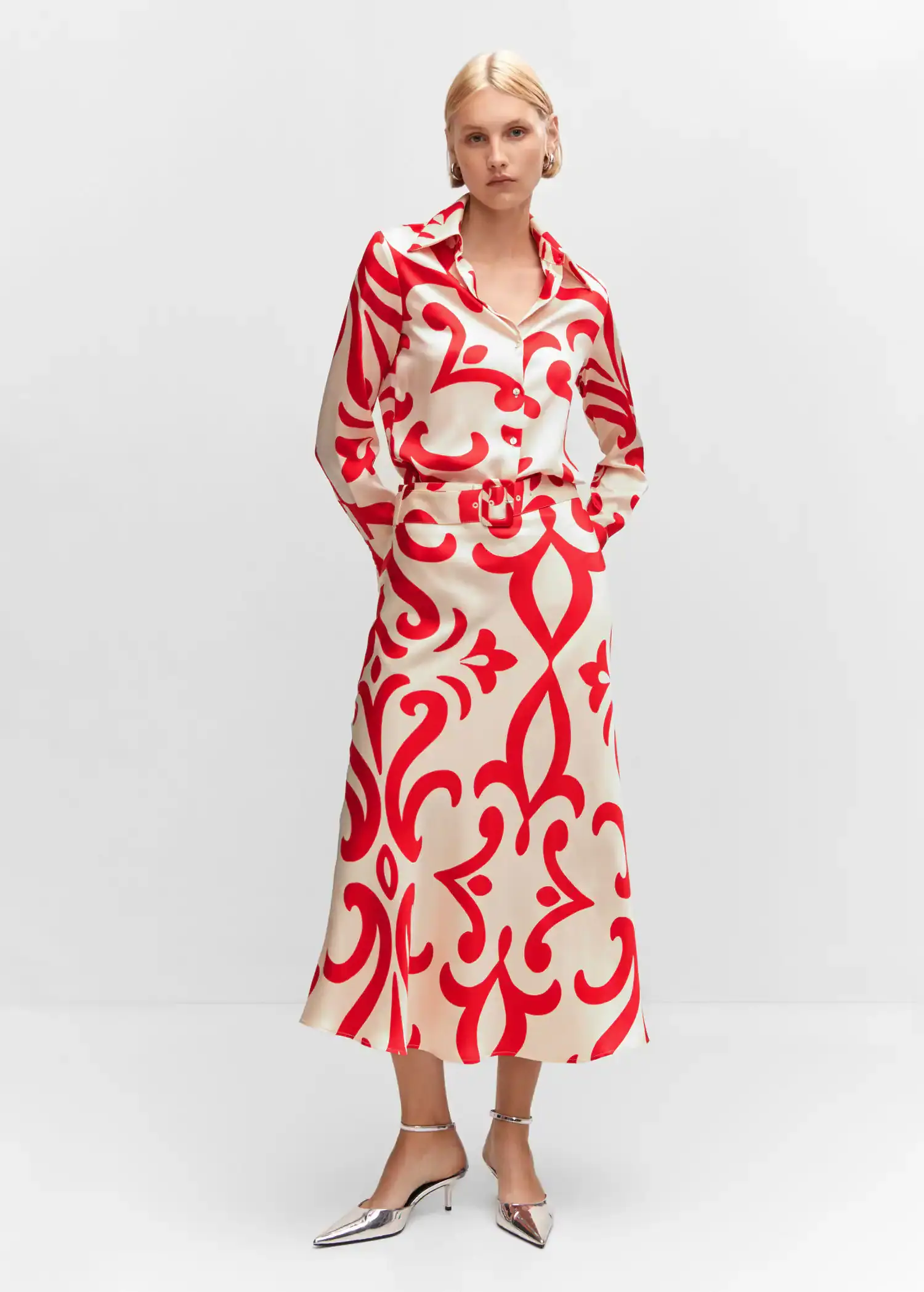 Mango Belt printed skirt. a woman wearing a red and white dress. 