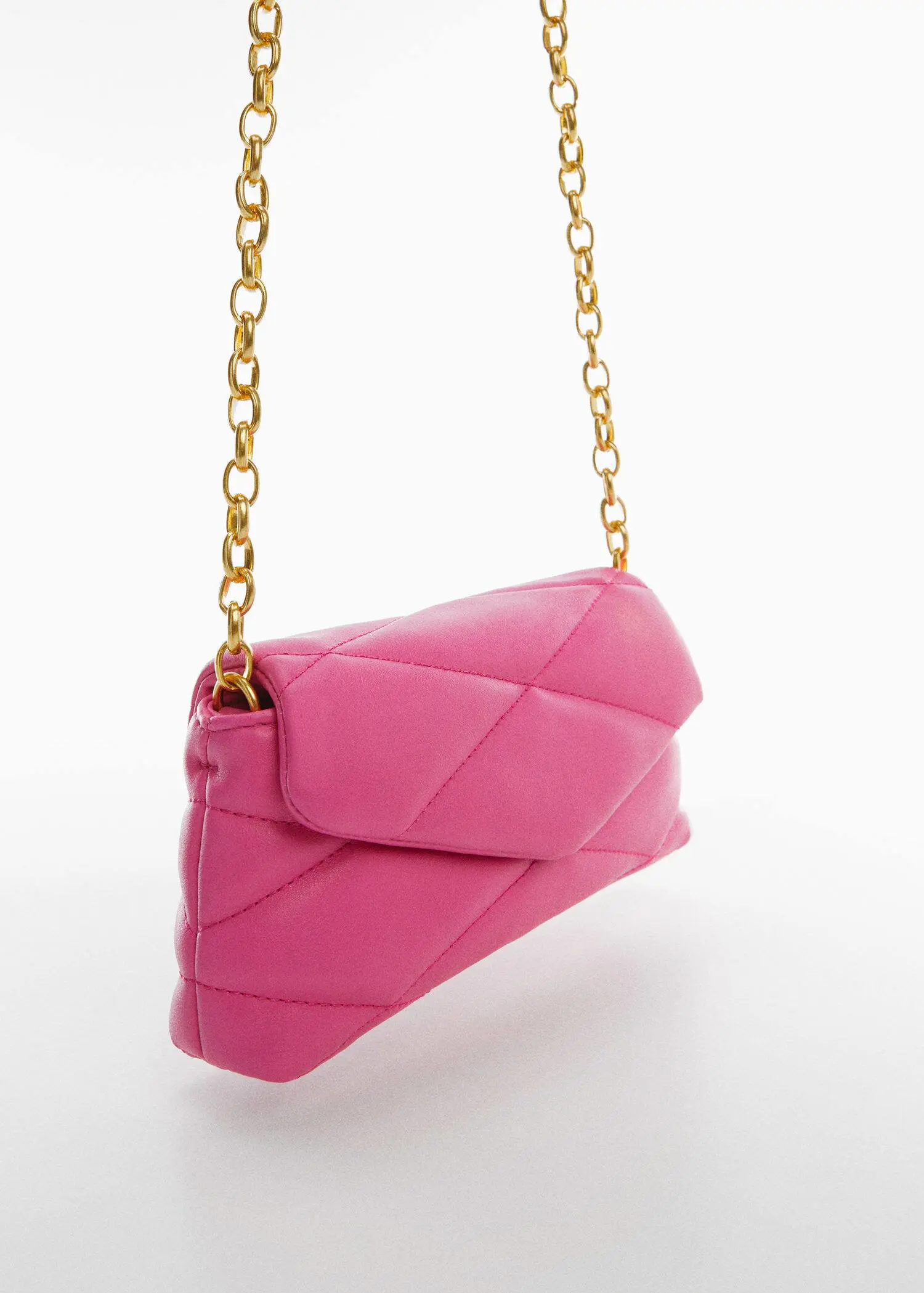 Mango Quilted chain bag. a close up of a pink purse on a white surface 
