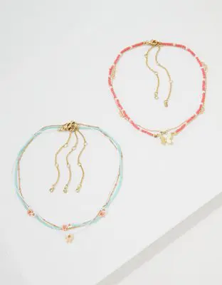 American Eagle O Coral Daisy Butterfly Necklace 3-Pack. 1