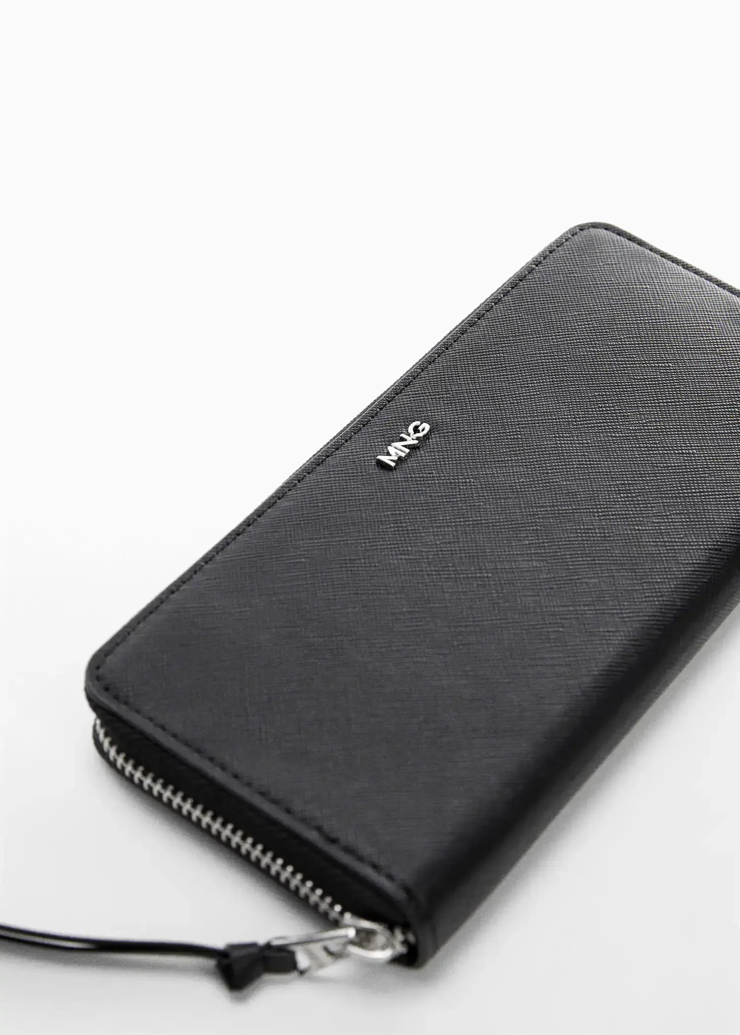 Mango Saffiano-effect wallet. a close-up of a black wallet on a table. 