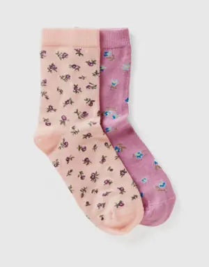two pairs of long floral patterned socks