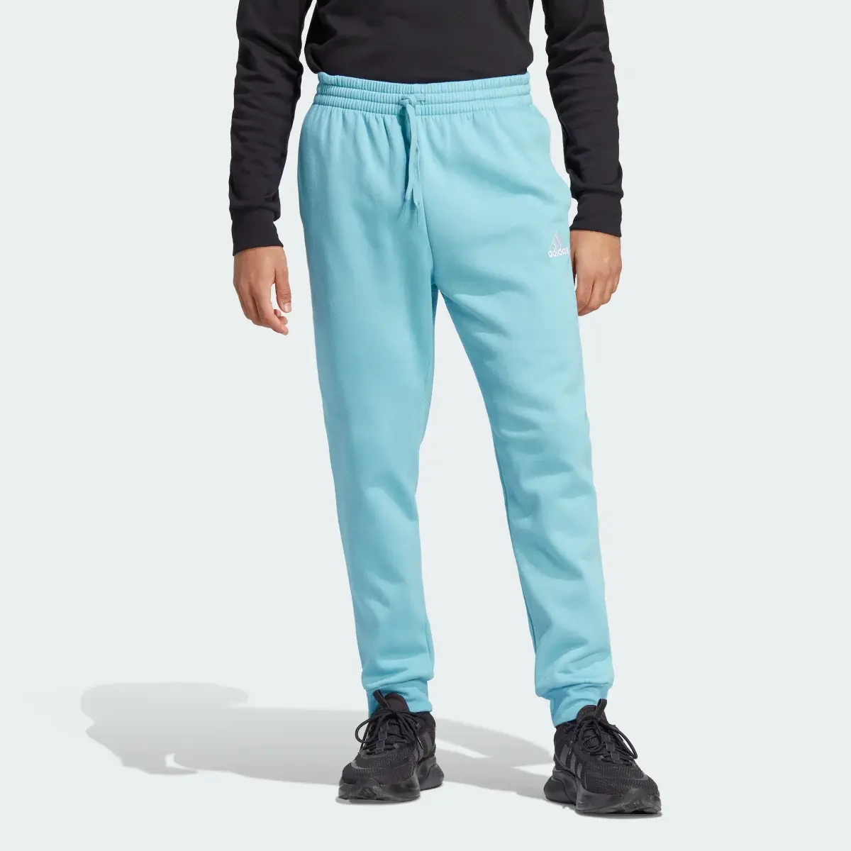 Adidas Essentials Fleece Regular Tapered Joggers. 1