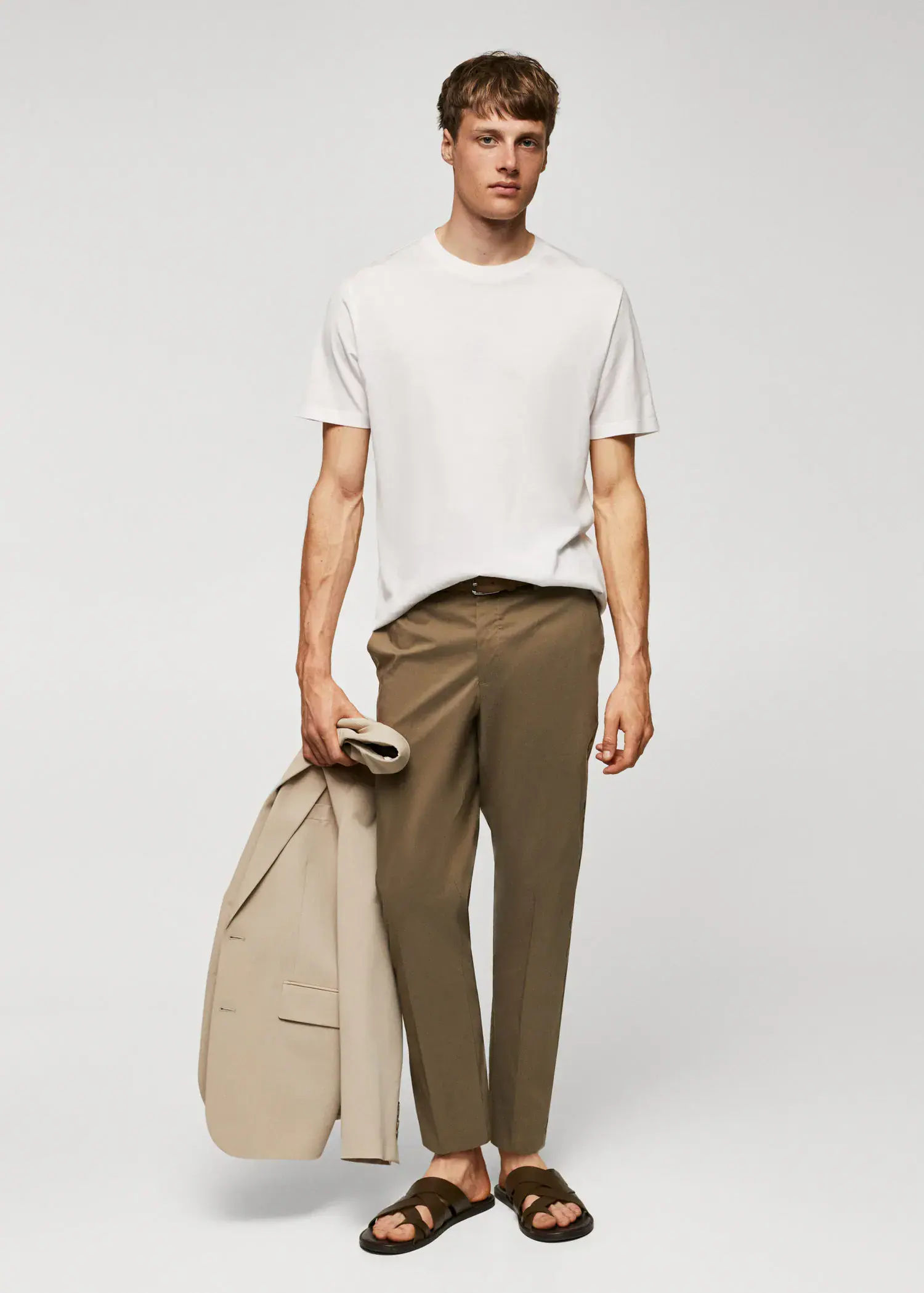 Mango Mercerised regular-fit t-shirt. a man in a white t-shirt is holding a bag. 