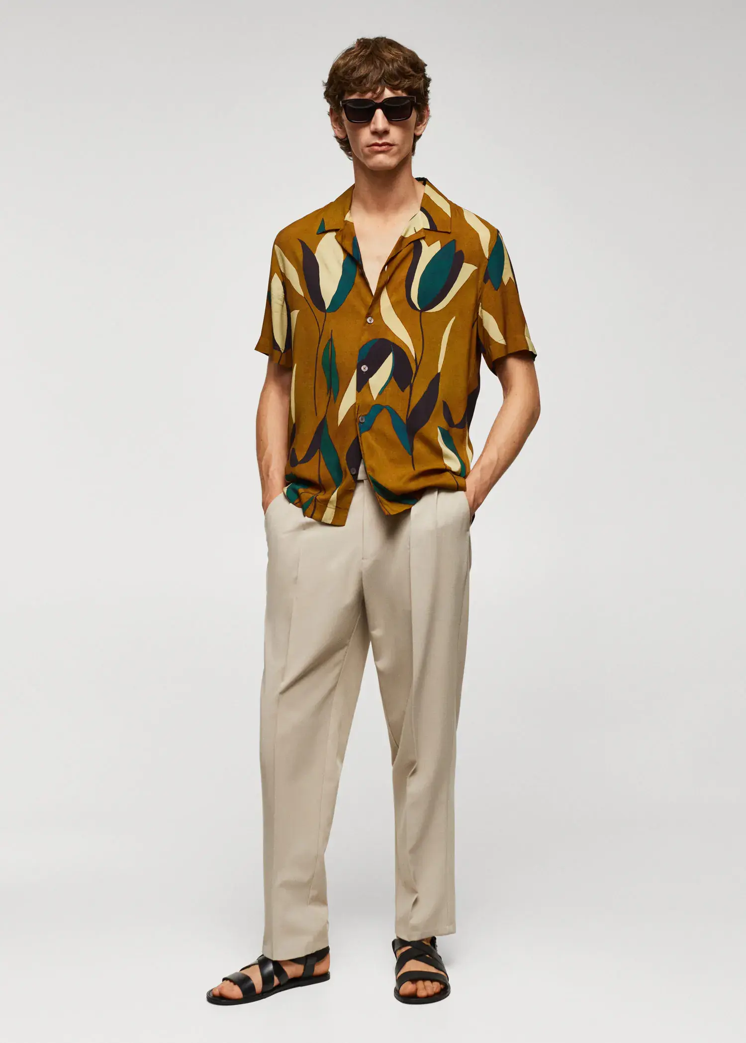 Mango Printed bowling shirt. a man standing in front of a white wall. 