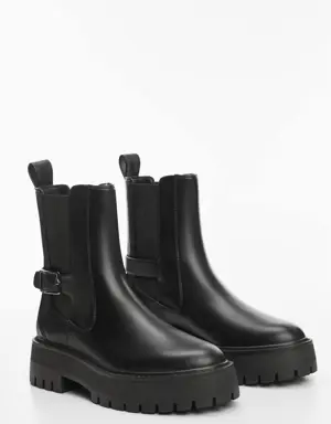 Ankle boots with elastic panel and buckle
