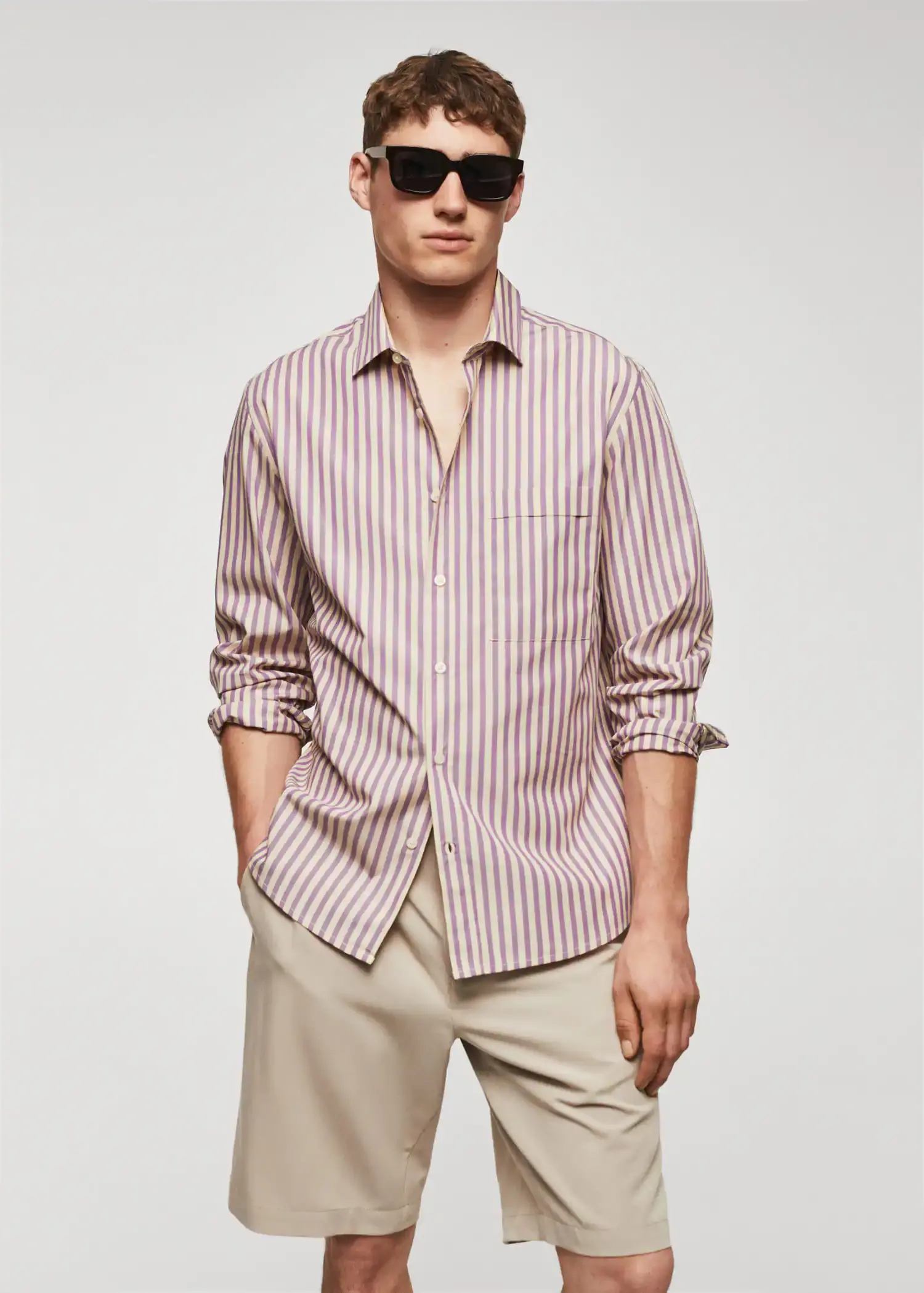Mango 100% cotton Kodak striped shirt . a man wearing sunglasses and a striped shirt. 