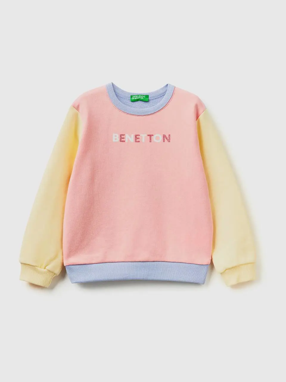 Benetton color block sweatshirt in organic cotton with glittery print. 1