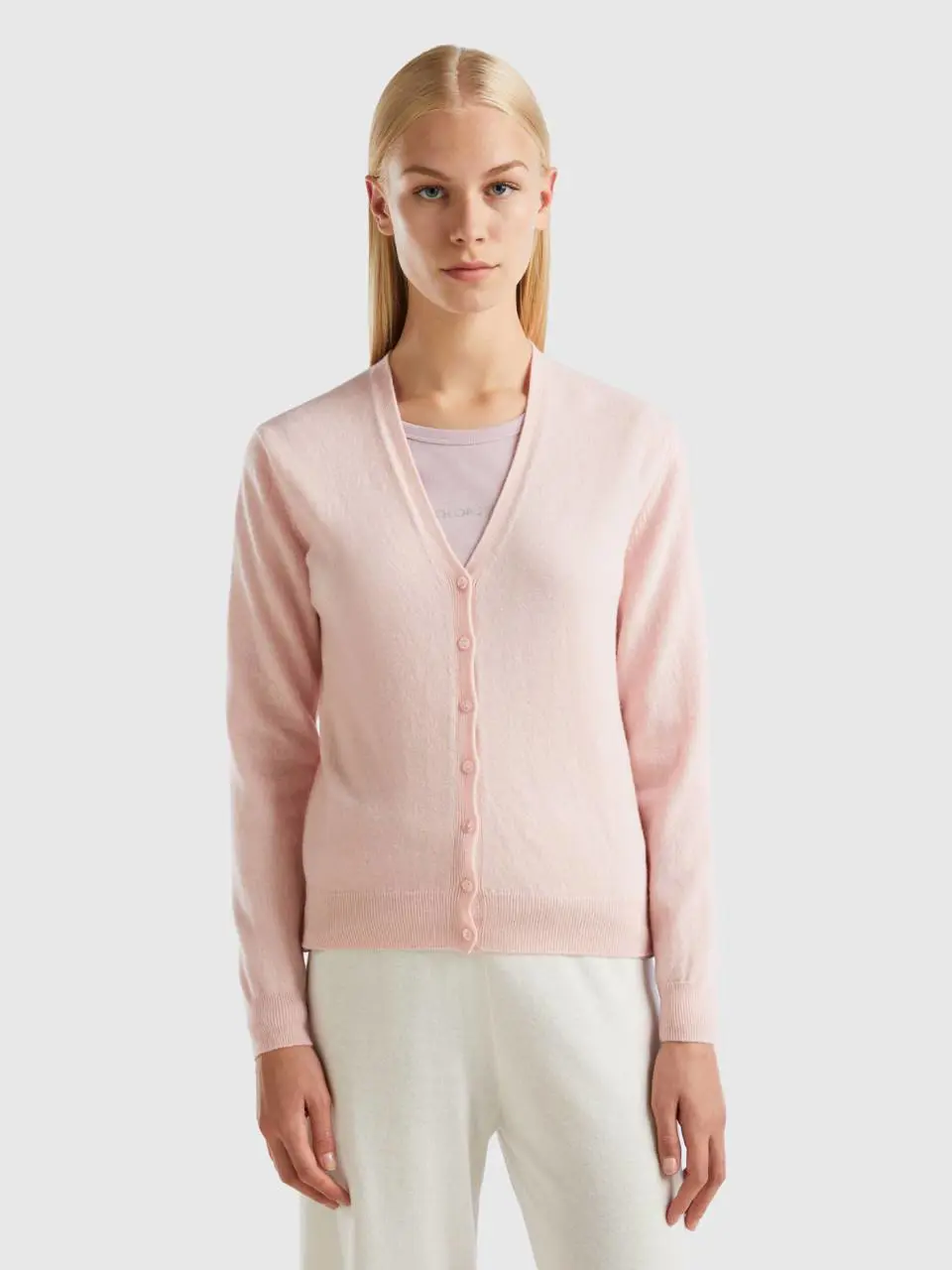 Benetton pastel pink v-neck cardigan in pure merino wool. 1