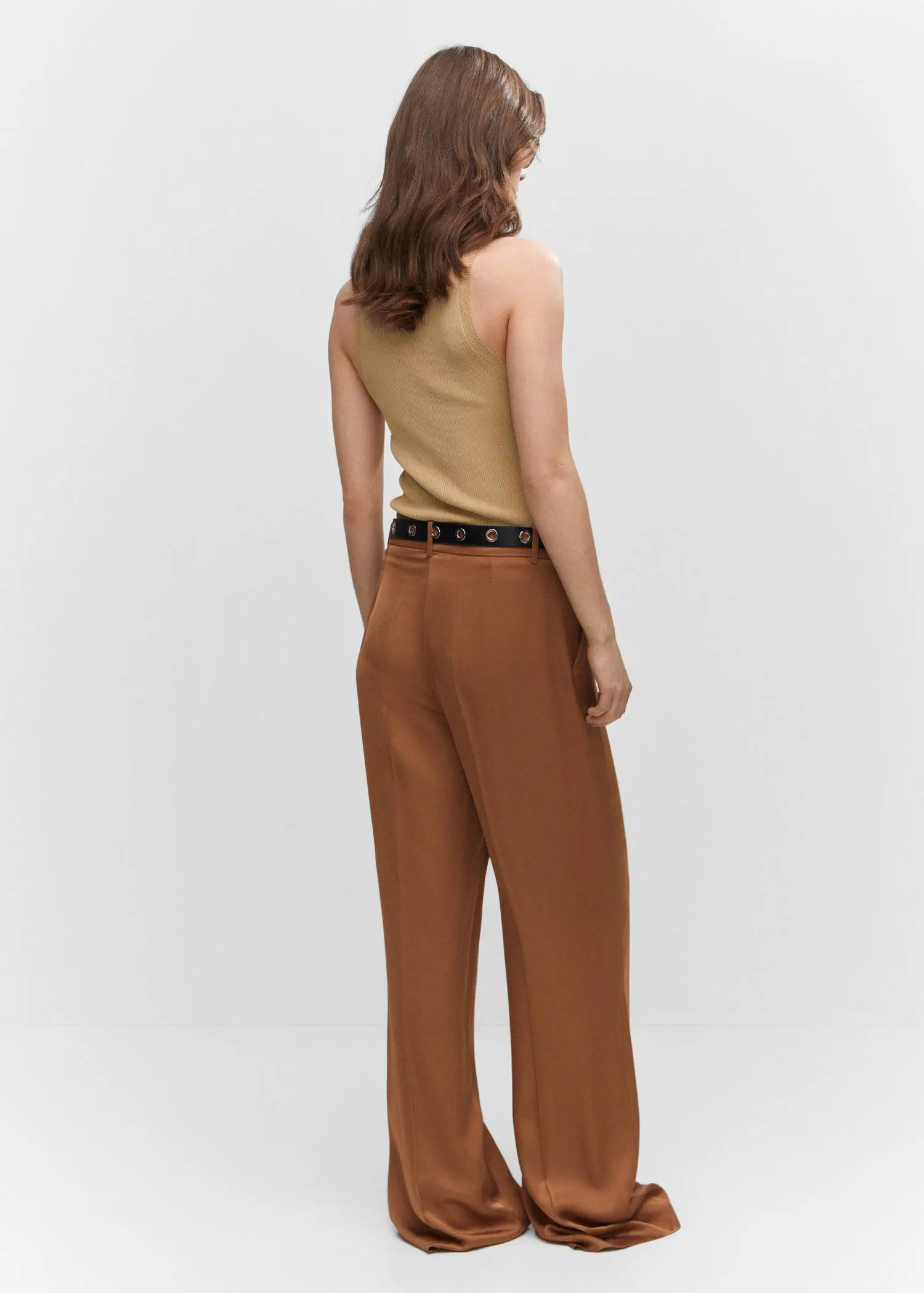 Mango Ribbed knit top. a woman wearing a tan tank top and brown pants. 