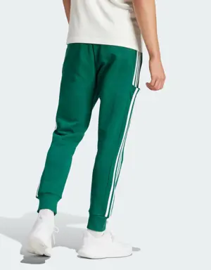 Adidas Essentials French Terry Tapered Cuff 3-Stripes Joggers. 2 Adidas Essentials French Terry Tapered Cuff 3-Stripes Joggers. 2