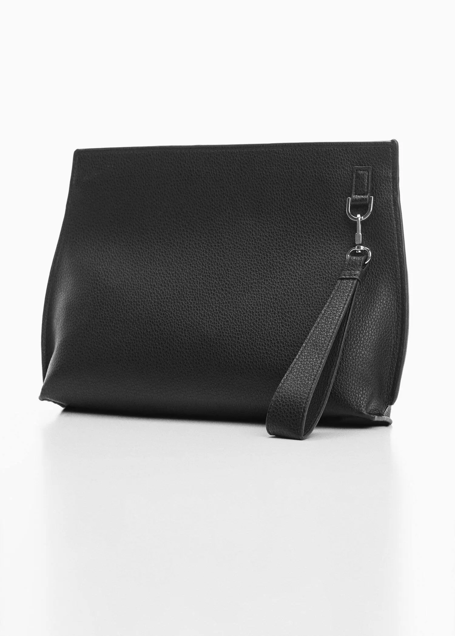 Mango Leather-effect case. a close-up of a black purse on a white surface. 