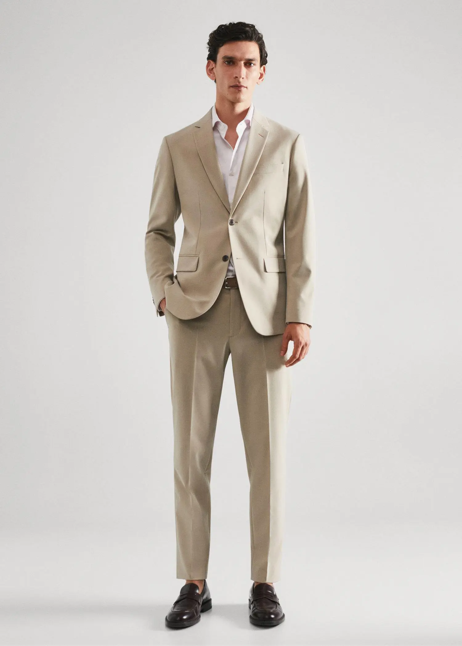 Mango Slim-fit micro-stripe twill suit shirt. a man in a suit standing in front of a white wall. 