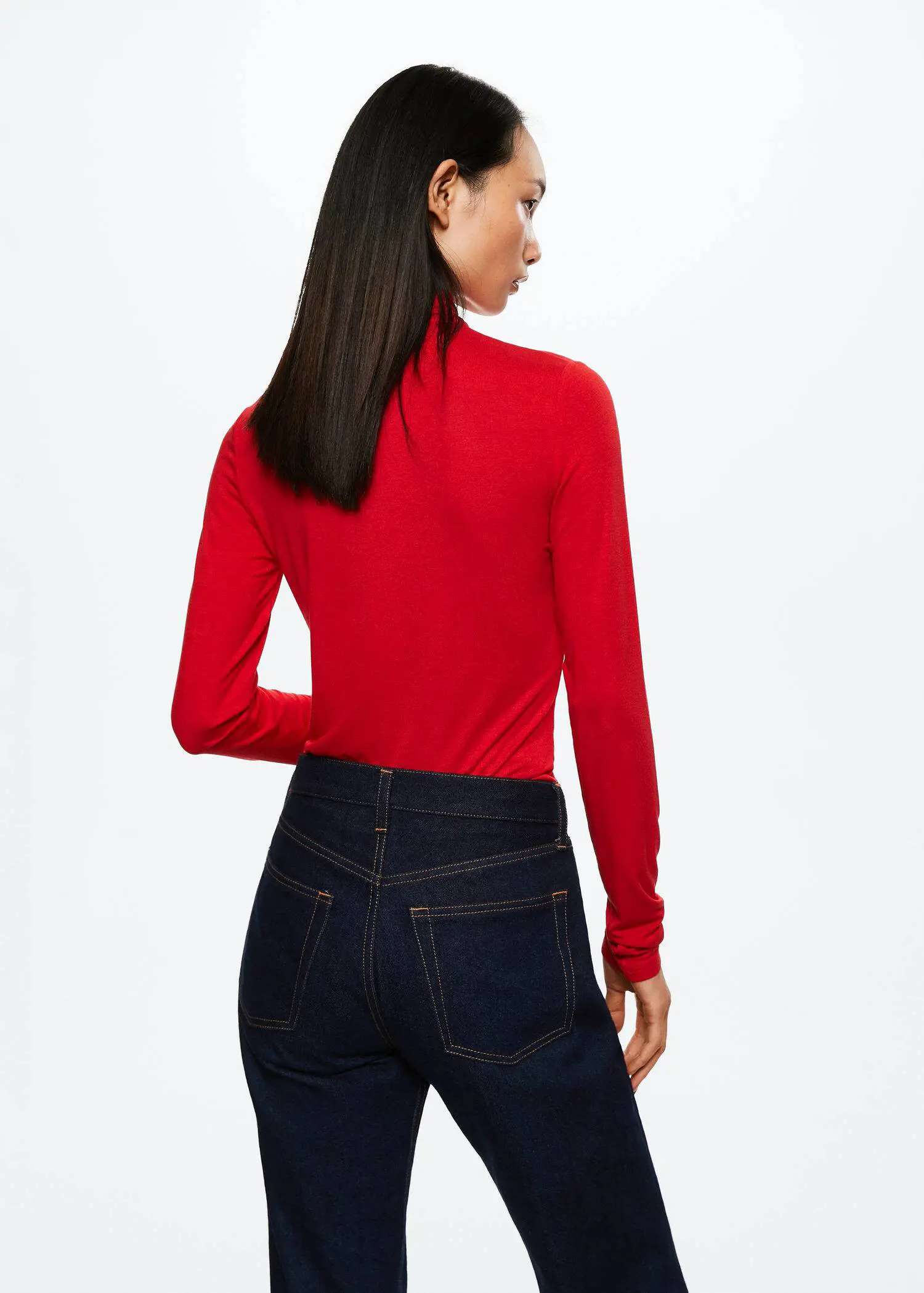 Mango Ruched detail T-shirt. a woman wearing a red shirt and jeans. 