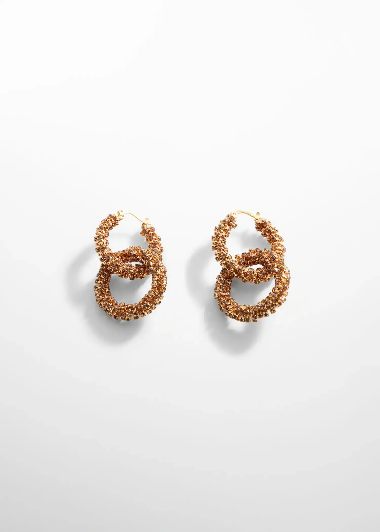 Mango Intertwined hoop earrings. a pair of earrings that are made out of beads. 