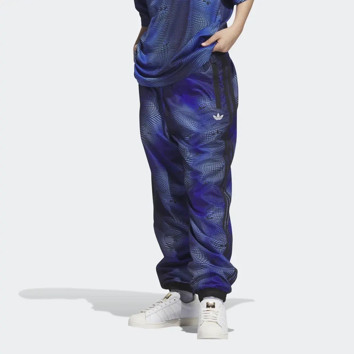 Adidas MV Allover Print Track Pants. 1