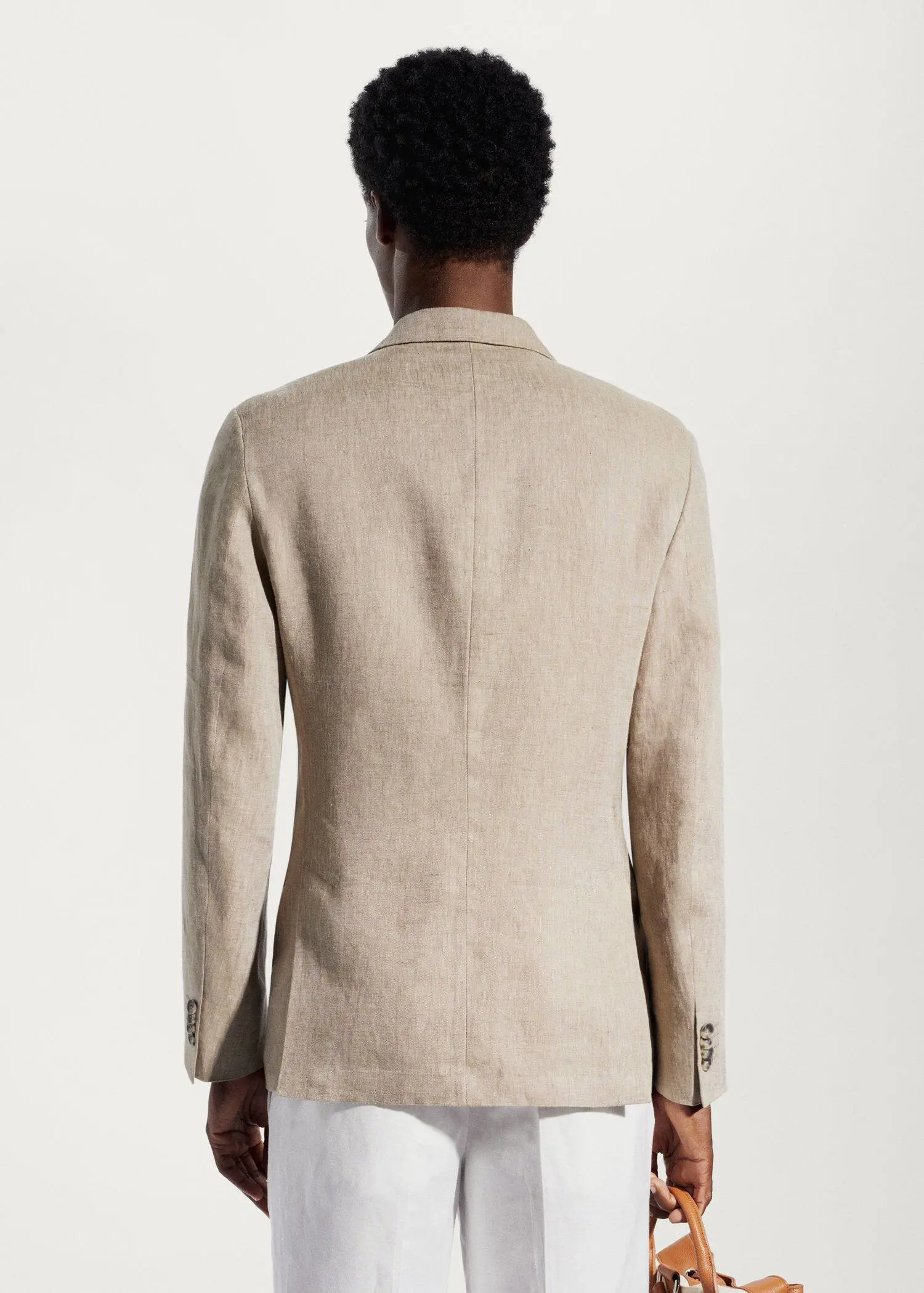 Mango 100% linen slim fit blazer. a man wearing a tan jacket and a white shirt. 