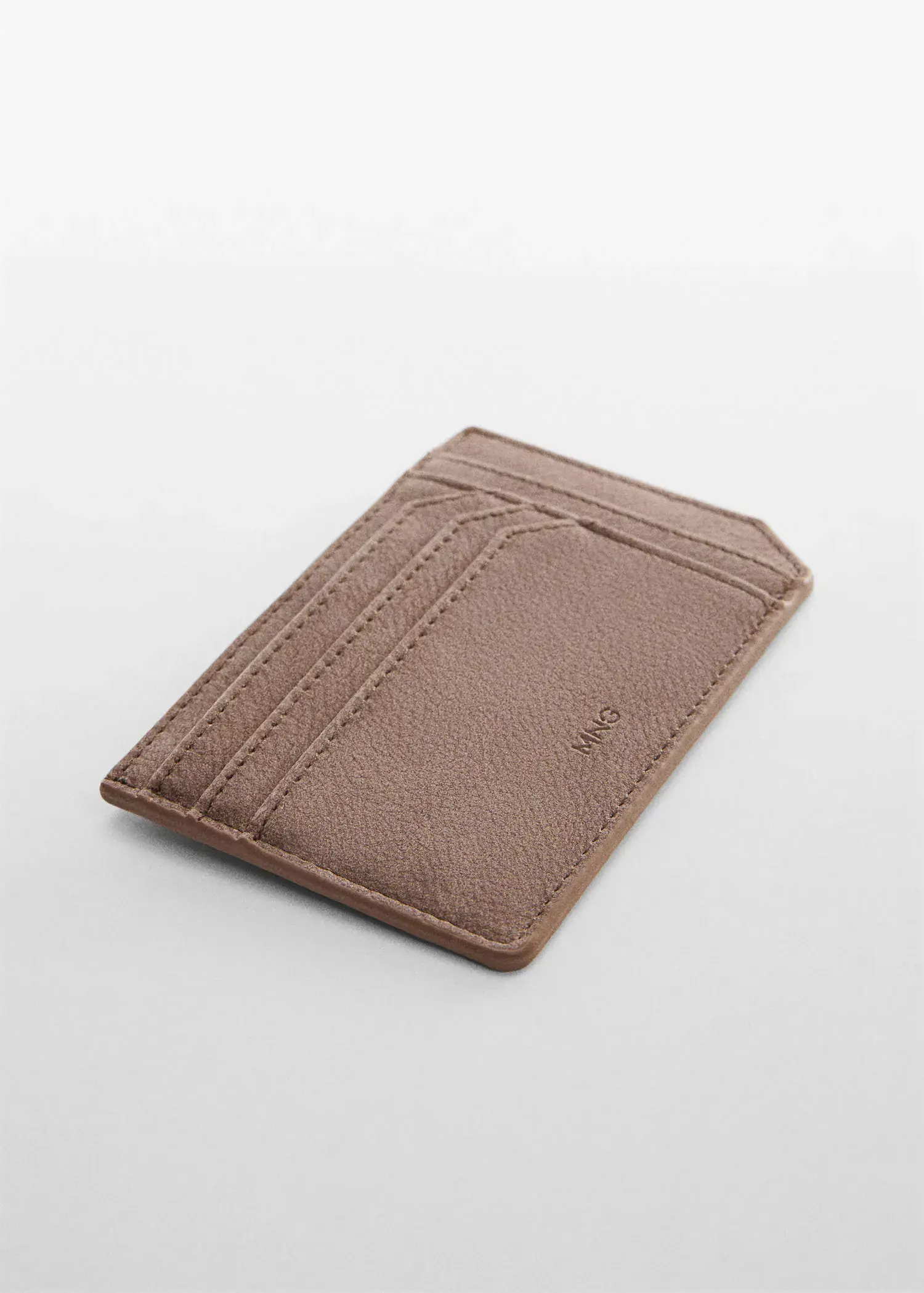 Mango Anti-contactless leather-effect card holder. a card holder that is sitting on a table. 