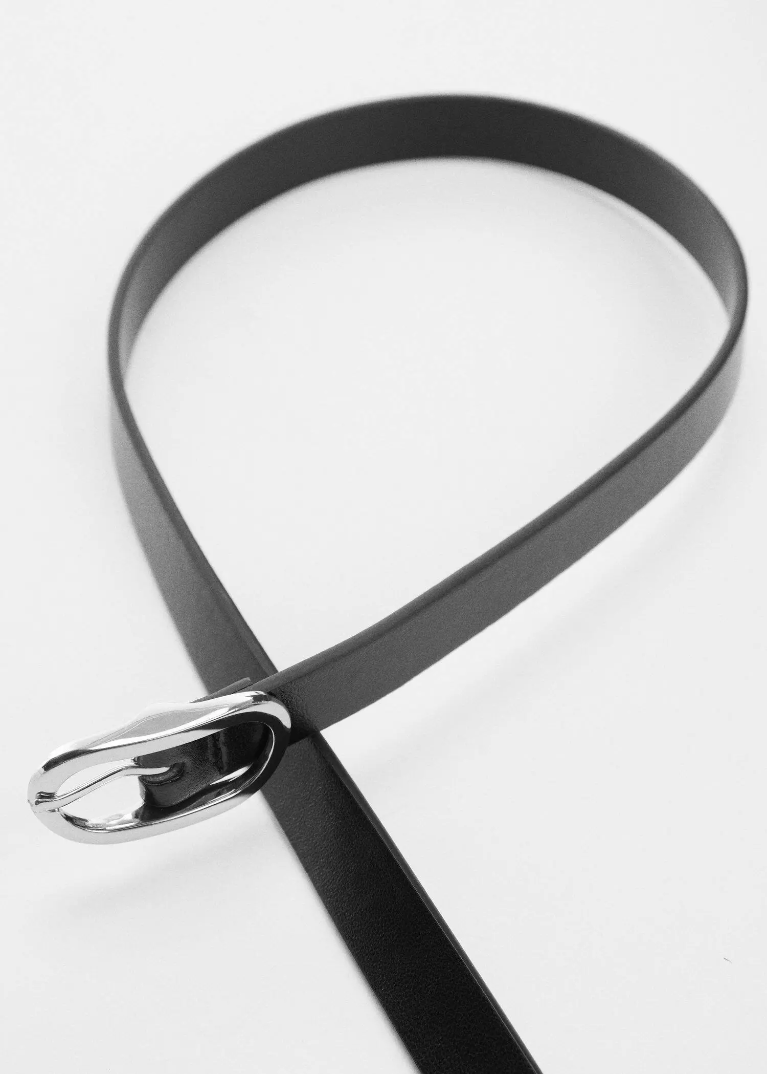 Mango Oval buckle belt. a close-up of a black belt with a silver buckle. 