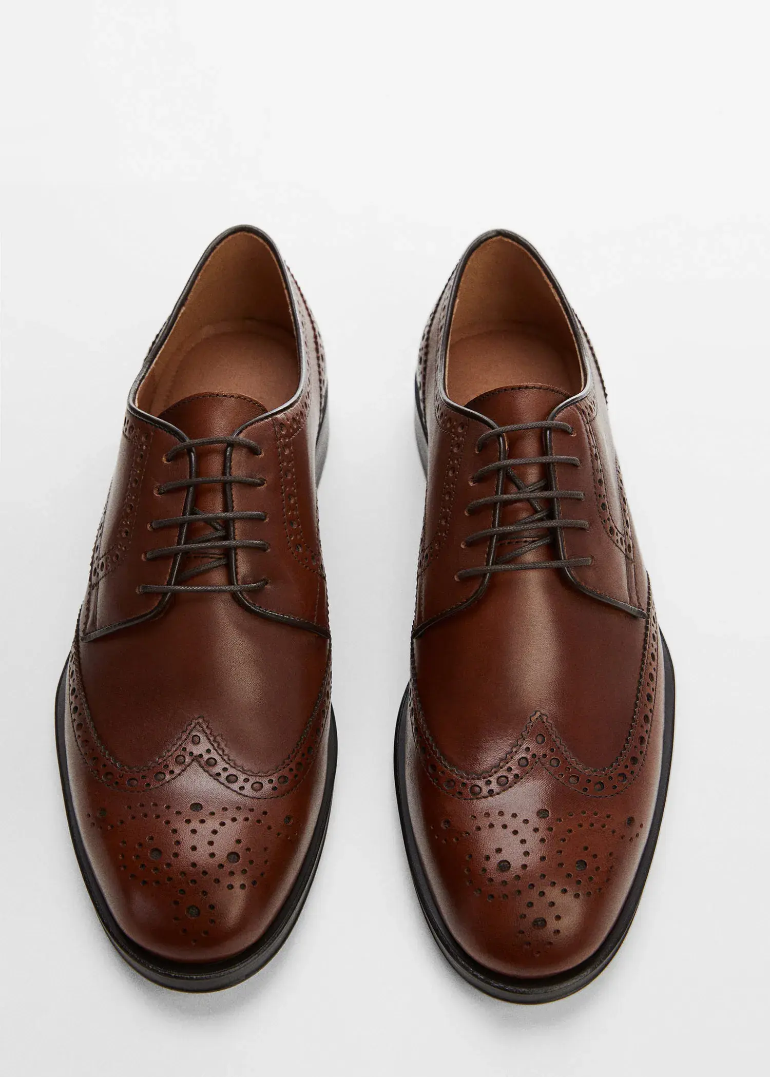 Mango Die-cut leather dress shoes. a pair of brown leather shoes on a white surface. 