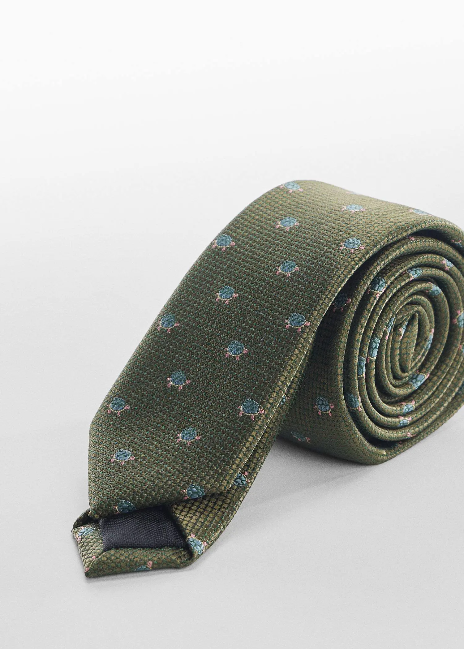 Mango Tie with animals print . a green neck tie on top of a table. 