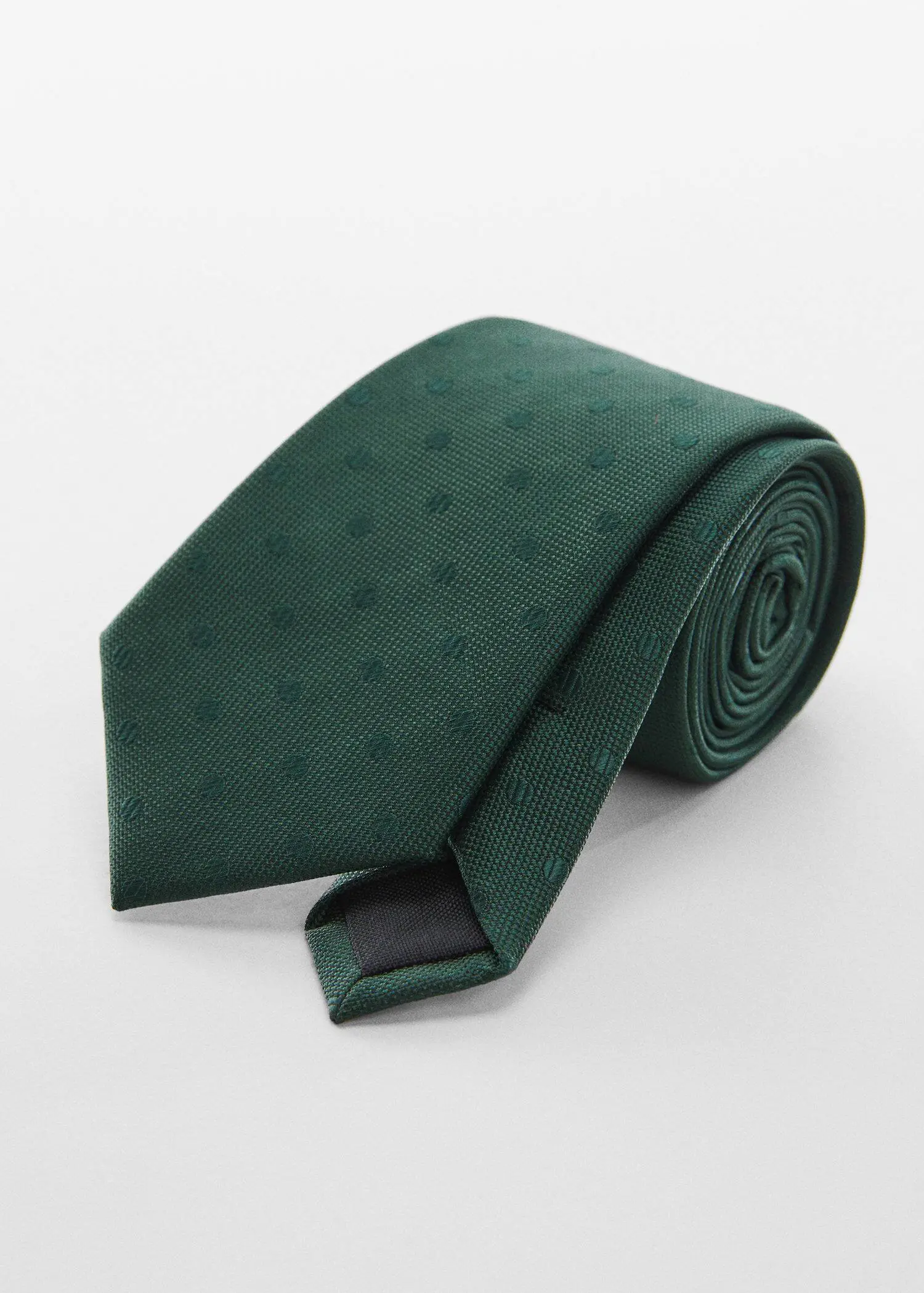Mango Micro-print tie. a close up of a green tie on a white surface 