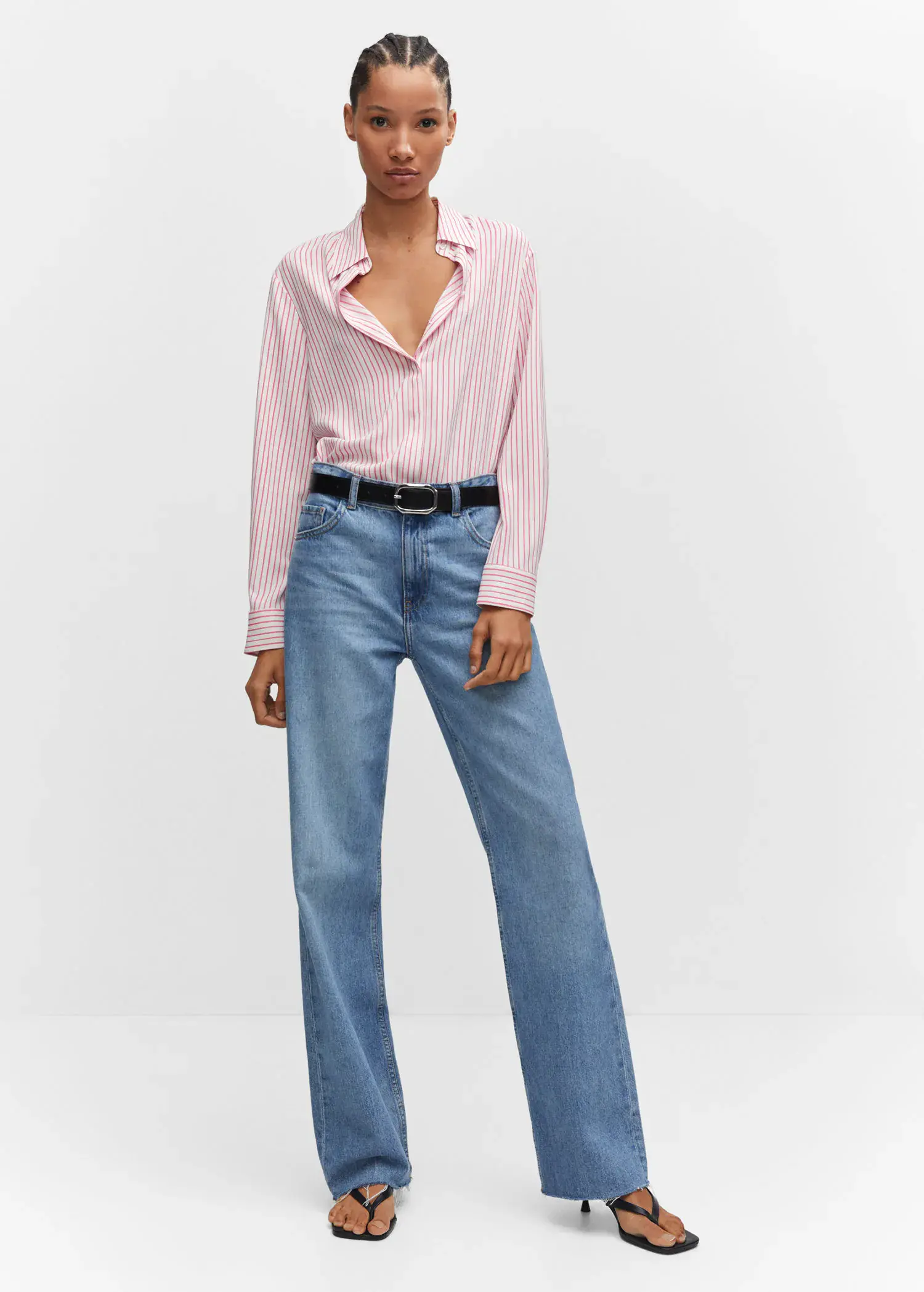 Mango Regular flowy shirt. a woman in a pink shirt and blue jeans. 