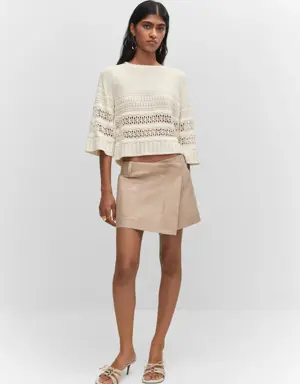 Openwork sweater with flared sleeves