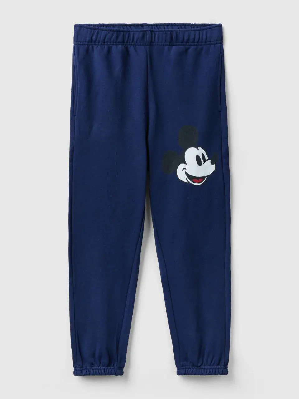 Benetton dark blue joggers with mickey mouse print. 1