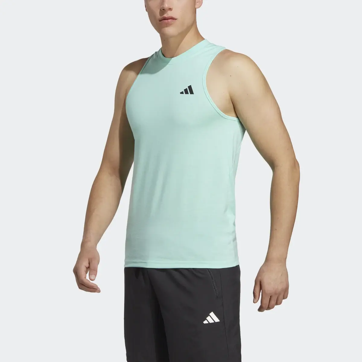 Adidas Playera Sin Mangas Train Essentials. 1